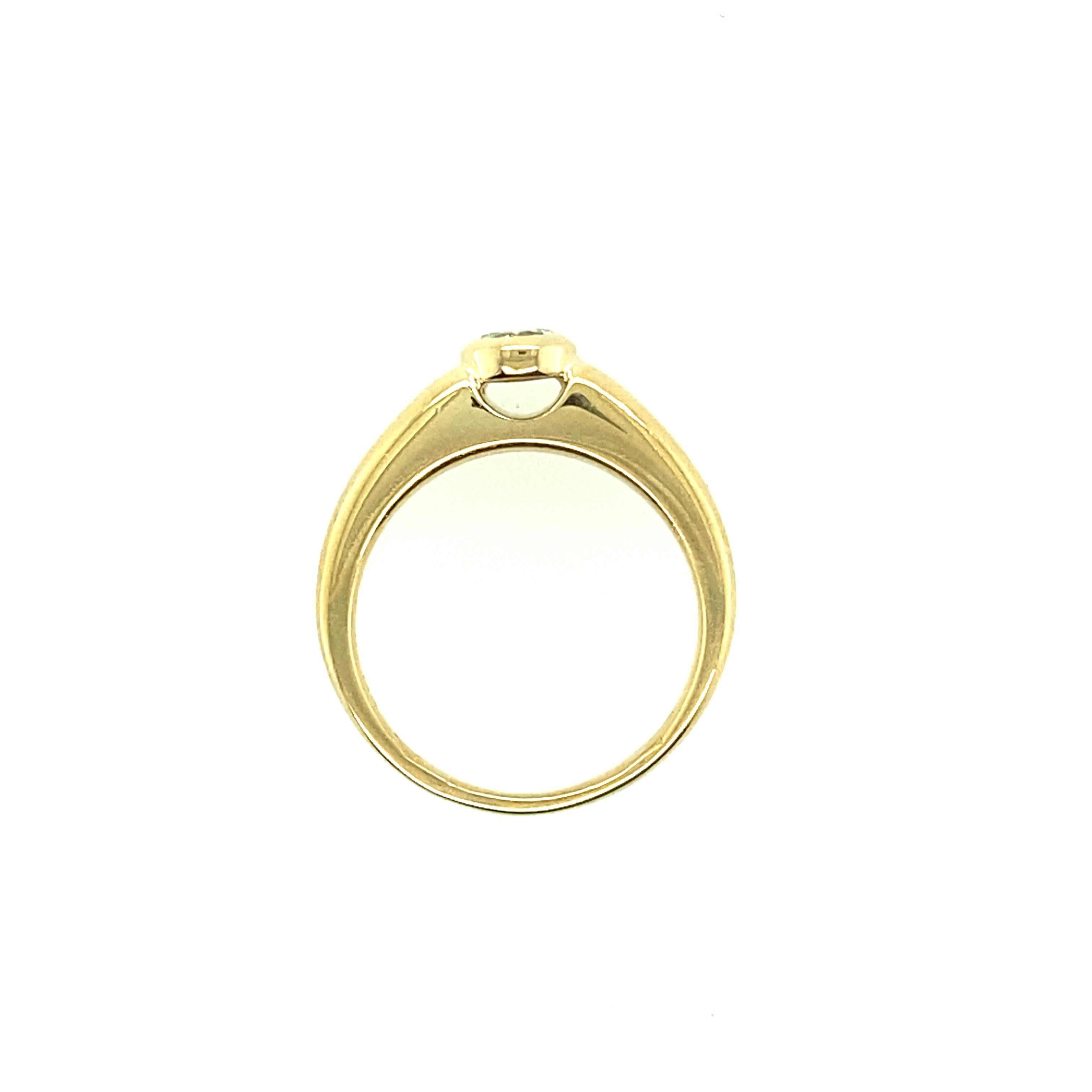 One 18 karat yellow gold diamond engagement ring bezel set with one brilliant-cut diamond, approximately  0.25 carat total with I/J color and SI clarity. 