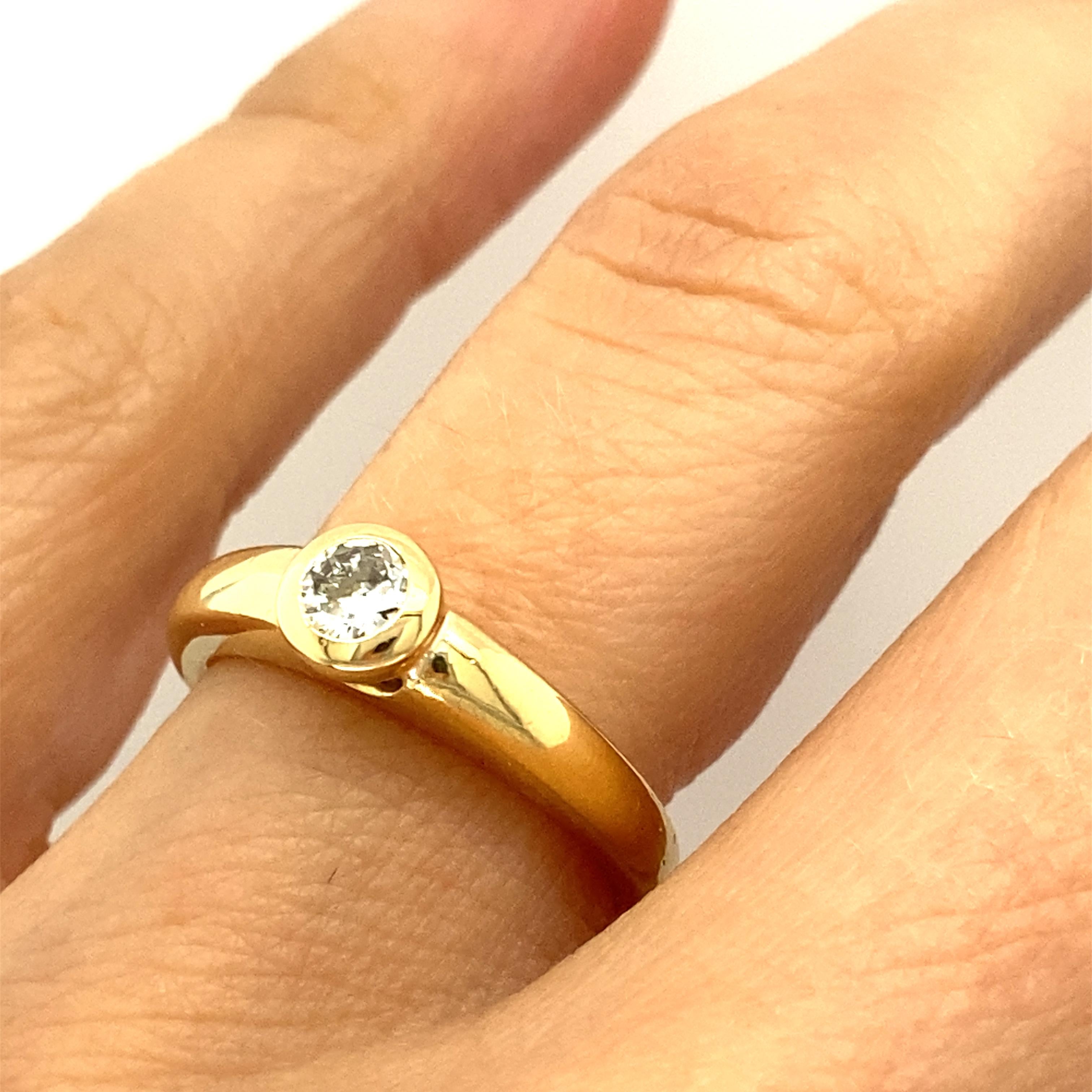 Round Cut 18 Karat Yellow Gold Bezel Set Diamond Engagement Ring For Sale