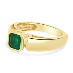 18 Karat Yellow Gold Bezel Set Emerald Cut Emerald Solitaire Ring