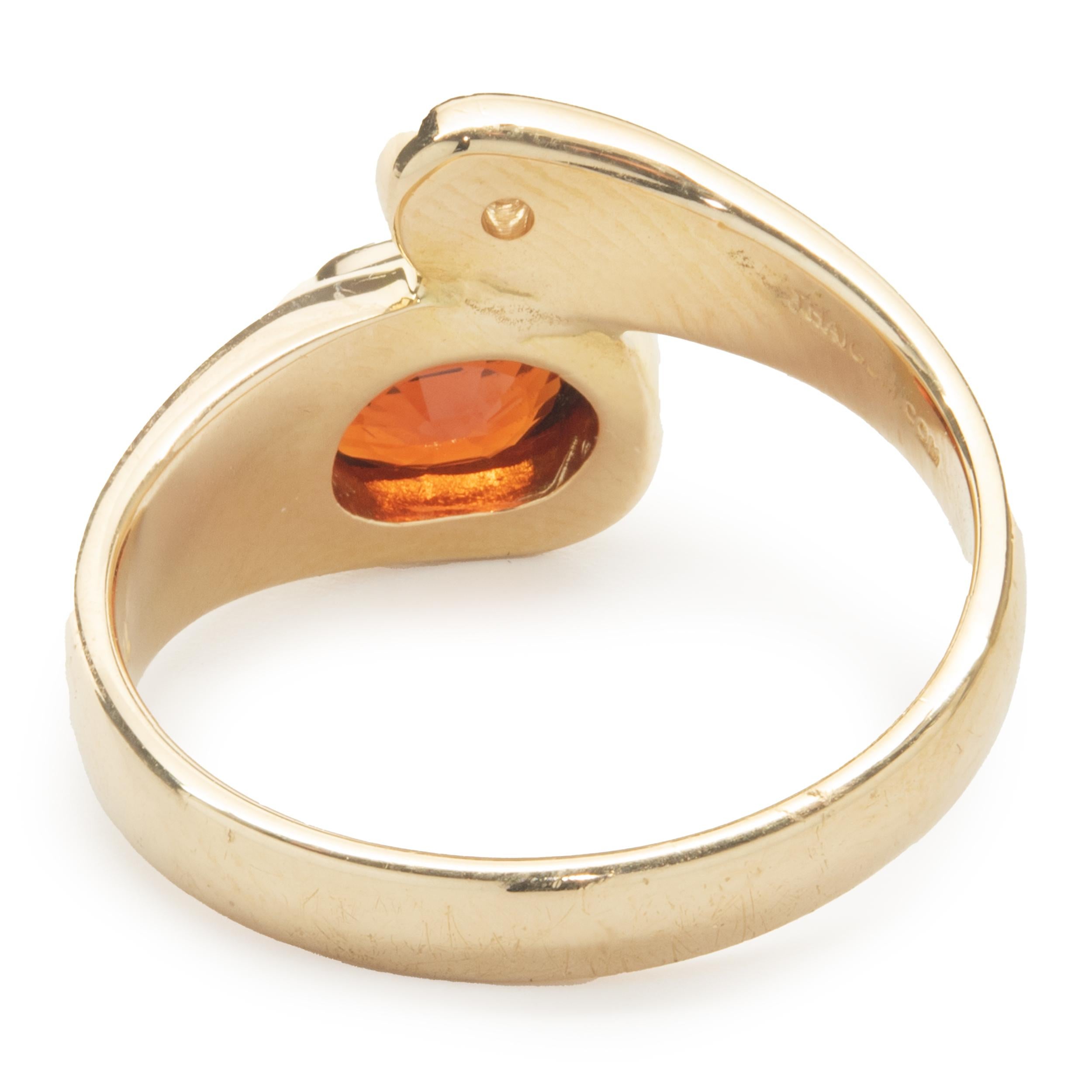 Round Cut 18 Karat Yellow Gold Bezel Set Garnet and Diamond Bypass Ring