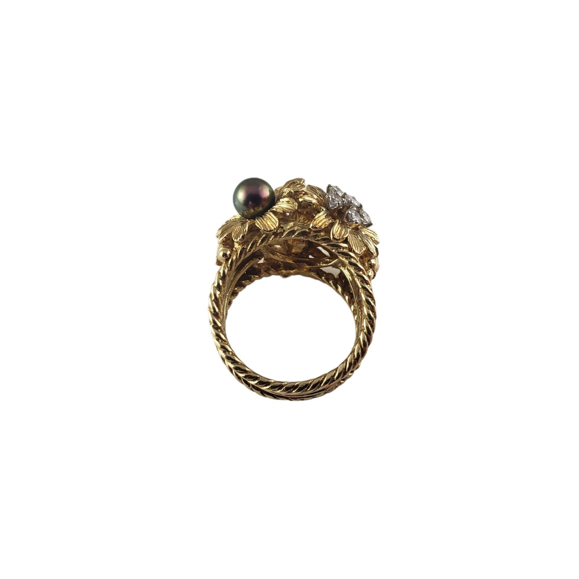Vintage 18 Karat Yellow Gold Black and White Pearl and Diamond Flower Ring Size 8-

This stunning 18K yellow gold ring features two black pearls ( 6 mm and 4 mm), two white pearls (6 mm and 4 mm), and six round brilliant cut diamonds set in a