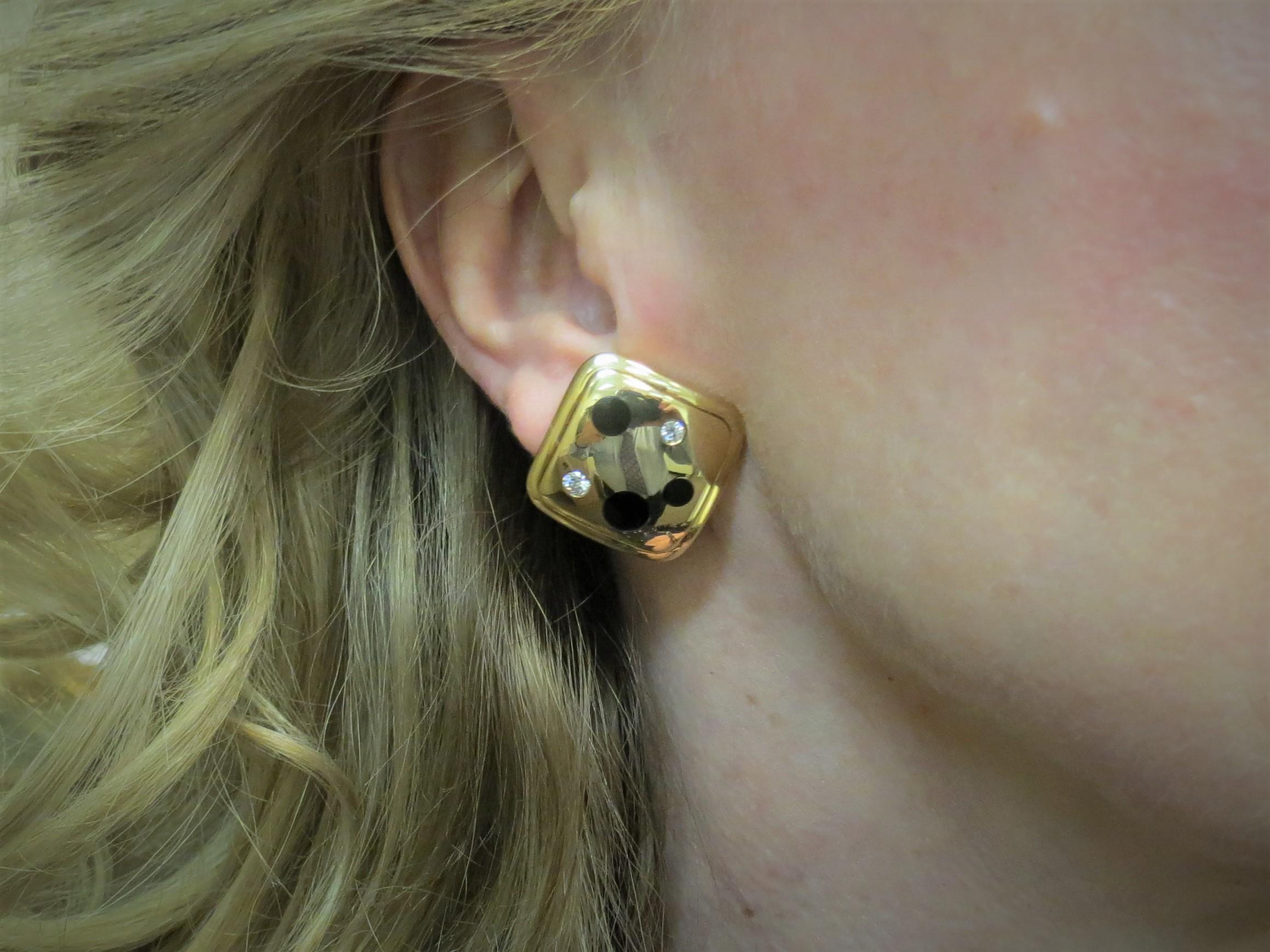 18K yellow gold earclips by Michael Bonanza, flush set with four full cut round diamonds weighing .32cts, G color, VS clarity, and black onyx circles.
Retail $6000