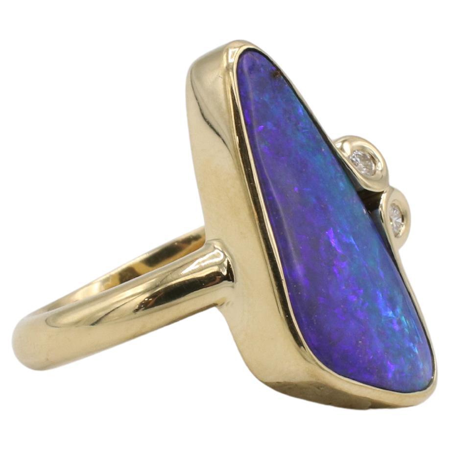 18 Karat Yellow Gold Black Opal & Natural Diamond Cocktail Statement Ring 
Metal: 18k yellow gold
Weight: 10.54 grams
Opal: 24 x 10mm
Diamonds: Approx. 0.20 CTW G VS round natural diaonds
Size: 7.5 (US)
Height: 4.5mm
TST F35000982