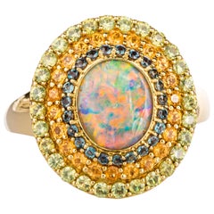 18 Karat Yellow Gold Black Opal Ring with Alexandrite, and Garnet Triple Halo