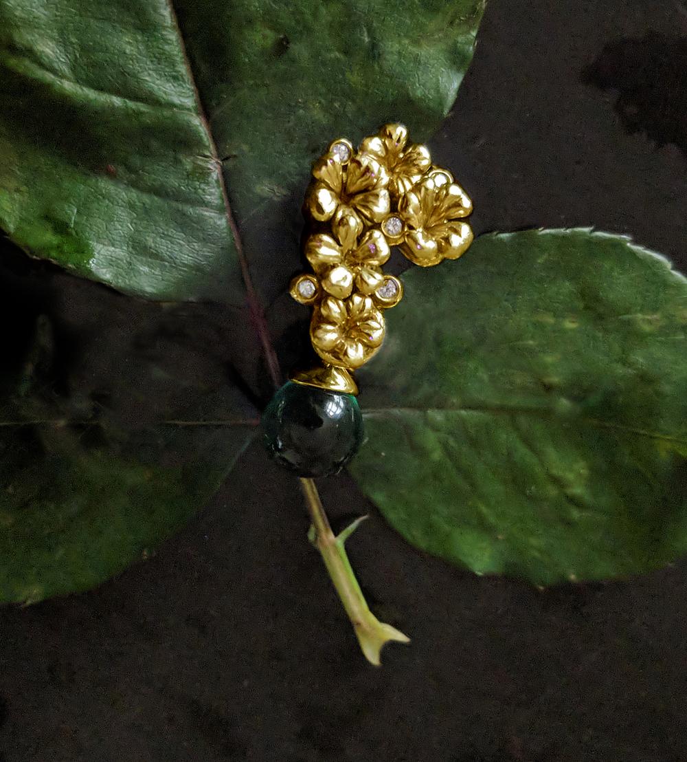 18 karat yellow gold Plum Blossom necklace pendant encrusted with 5 round diamonds and green cabochon drop green grown quartz or natural chalcedony. This contemporary jewellery collection has been featured in Vogue UA review. We use top natural
