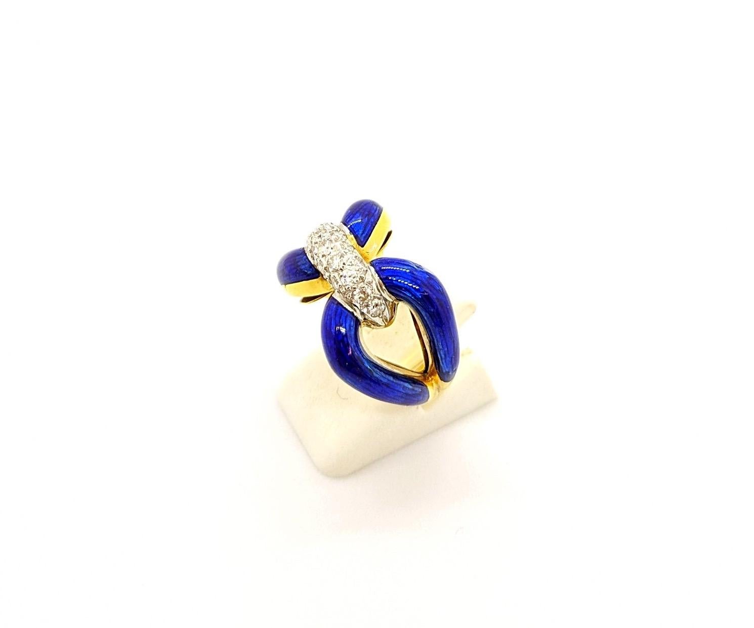 The perfect wearable vintage best describes this 18 karat yellow gold ring.  Designed with brilliant royal blue enamel and a pave diamond center, this ring is actually right up to the minute style. 
Diamond weight 0.43 carats
There are 2 jewelers
