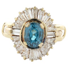 18 Karat Yellow Gold Blue Zircon and Baguette Cut Diamond Ballerina Ring
