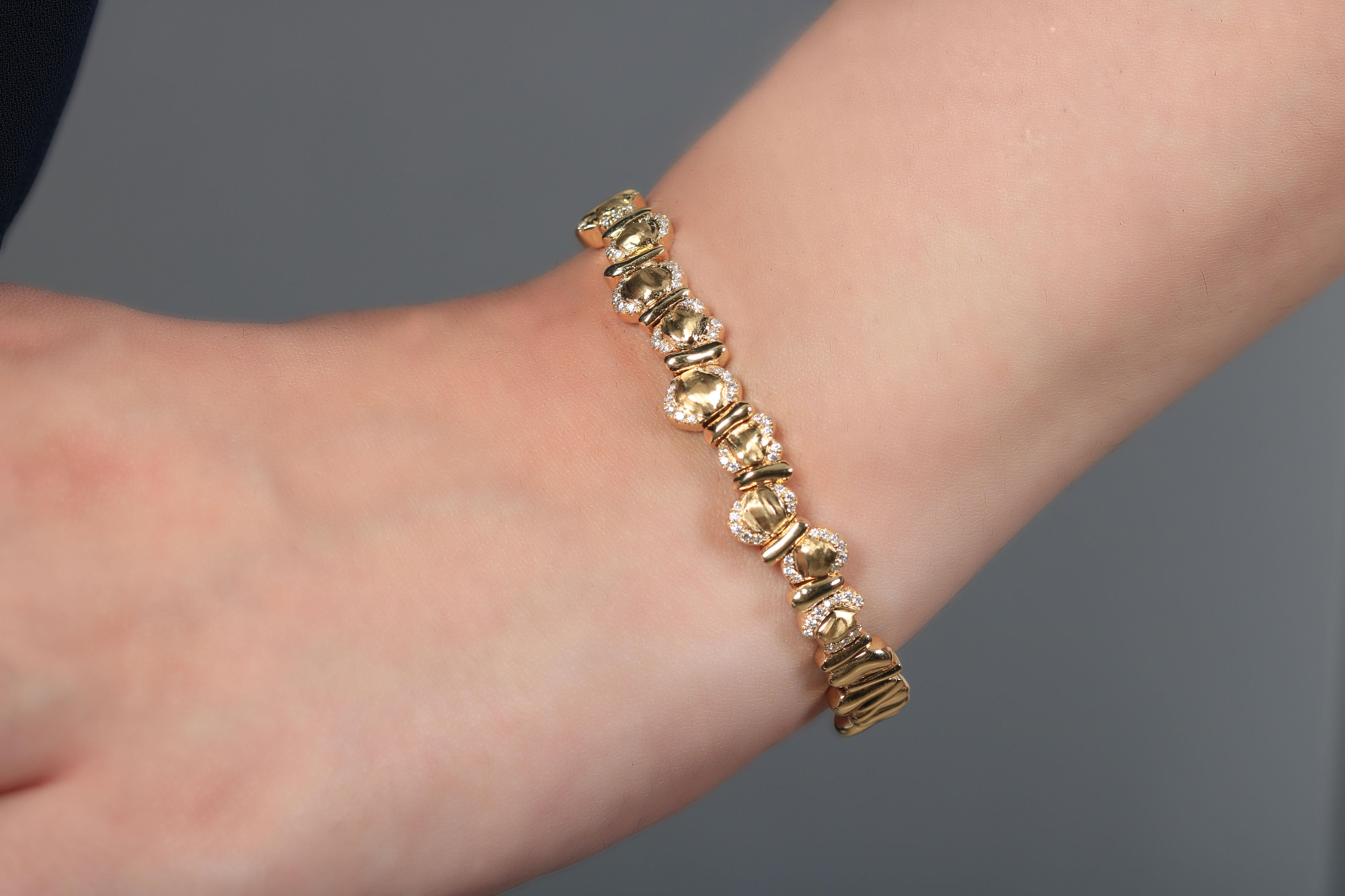 A perfect addition, this unique gold bracelet is set using yellow gold and white diamonds bound together forming an innovative look. The sophisticated design is timeless and absolutely compelling. Its beaded appearance and make it especially