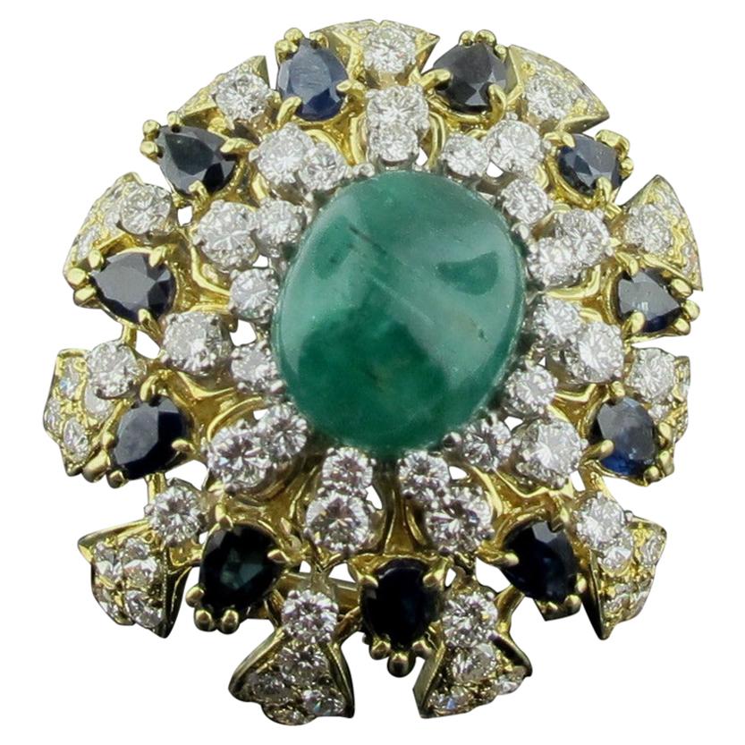 18 Karat Yellow Gold Brooch with Diamonds, Sapphires and a Cab Emerald Center For Sale