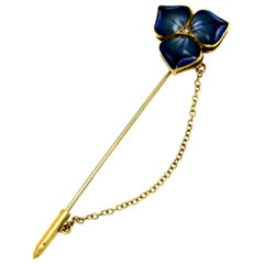 Spilla in oro giallo 18 carati con fiore smaltato e diamante centrale