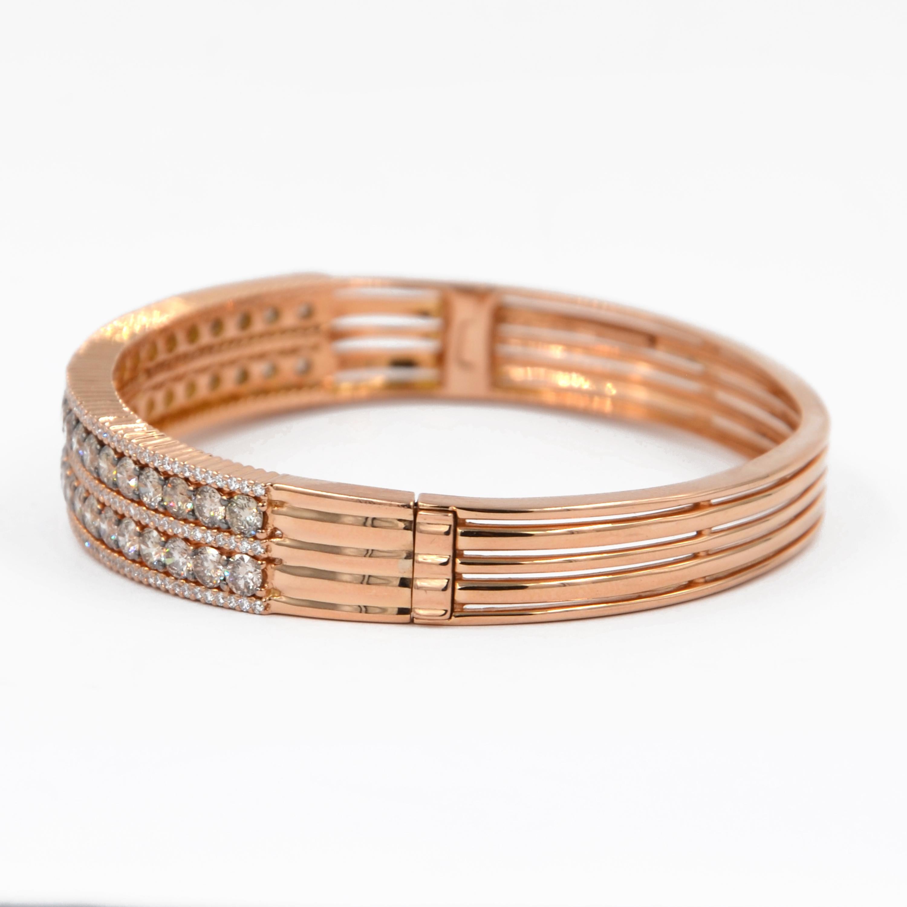 18KT Rose Gold Brown and White Diamonds GARAVELLI BRACELET 
Oval shape diameters mm 63X50 with clasp . 
GOLD  gr: 39.30
BROWN DIAMONDS ct : 5.65
WHITE DIAMONDS ct 1.30