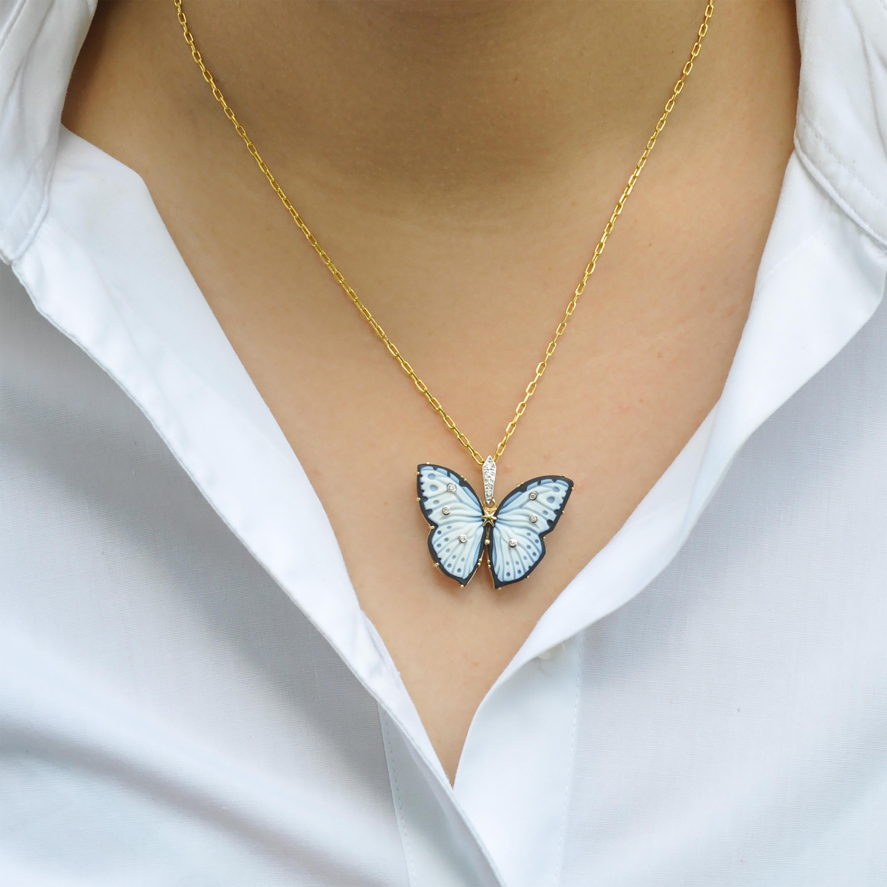 The One of a Kind 18 Karat Yellow Gold Butterfly Hand-Carved Agate with Diamonds Pendant Necklace is a truly exceptional piece of jewelry. The pendant features a stunning butterfly design, meticulously hand-carved from natural agate.

The agate used