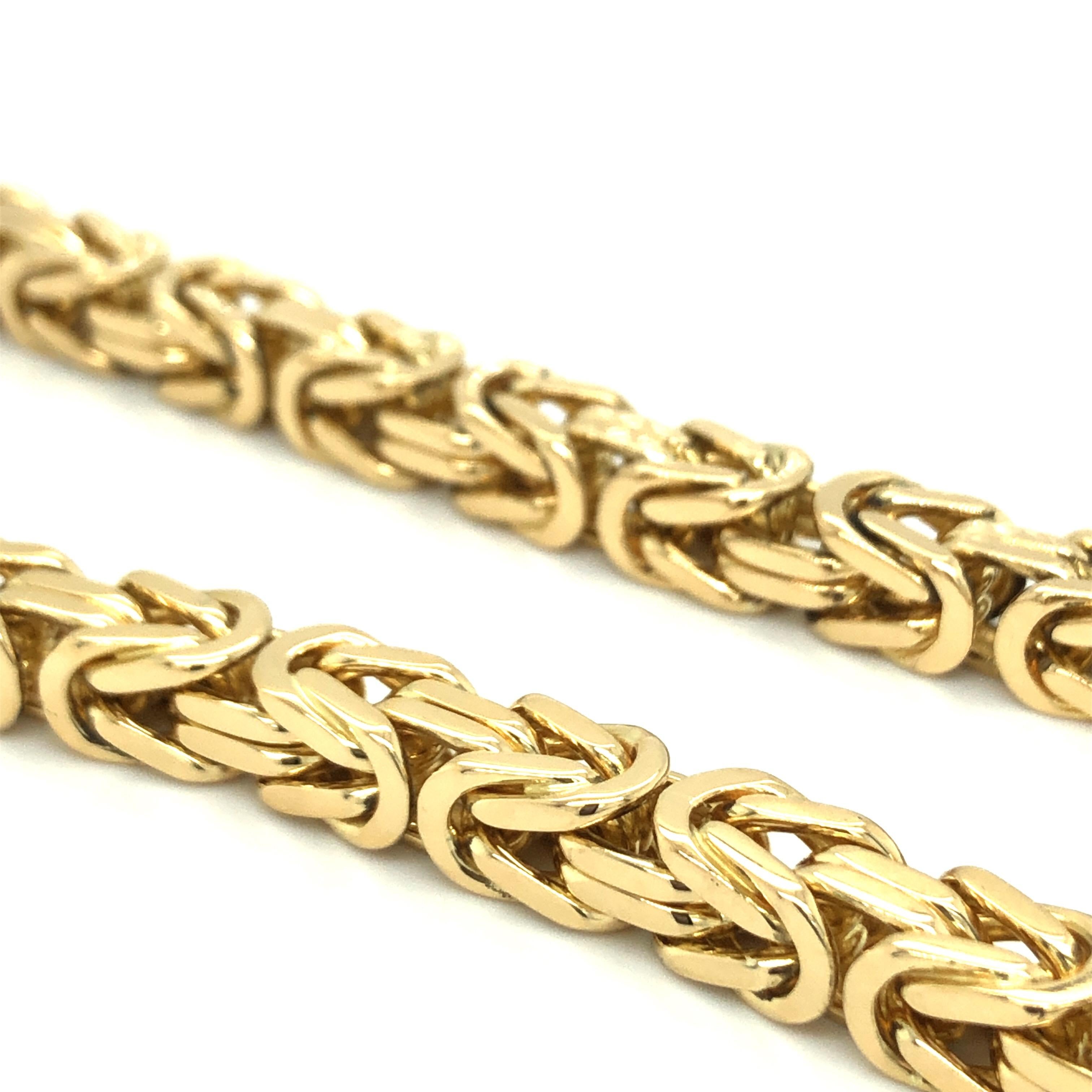 Bold 18 karat yellow gold Byzantine chain necklace by Bucherer.
This statement necklace is supple, flexible and drapes well. It is very comfortable to wear in spite of its weight. The necklace fastens with a secure push clasp, which is disguised