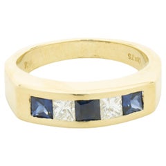 18 Karat Yellow Gold Channel Set Alternating Diamond and Sapphire Ring