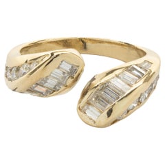 18 Karat Yellow Gold Channel Set Round and Baguette Cut Diamond Bypass Ring