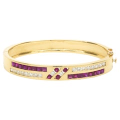 18 Karat Yellow Gold Channel Set Ruby and Diamond Bangle Bracelet