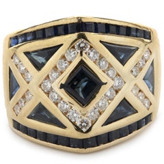 18 Karat Yellow Gold Channel Set Sapphire and Diamond Ring