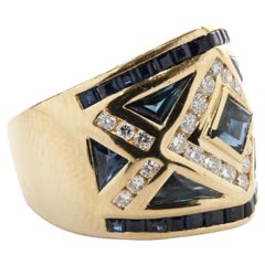 18 Karat Gelbgold Ring mit kanaleingefasstem Saphir und Diamant