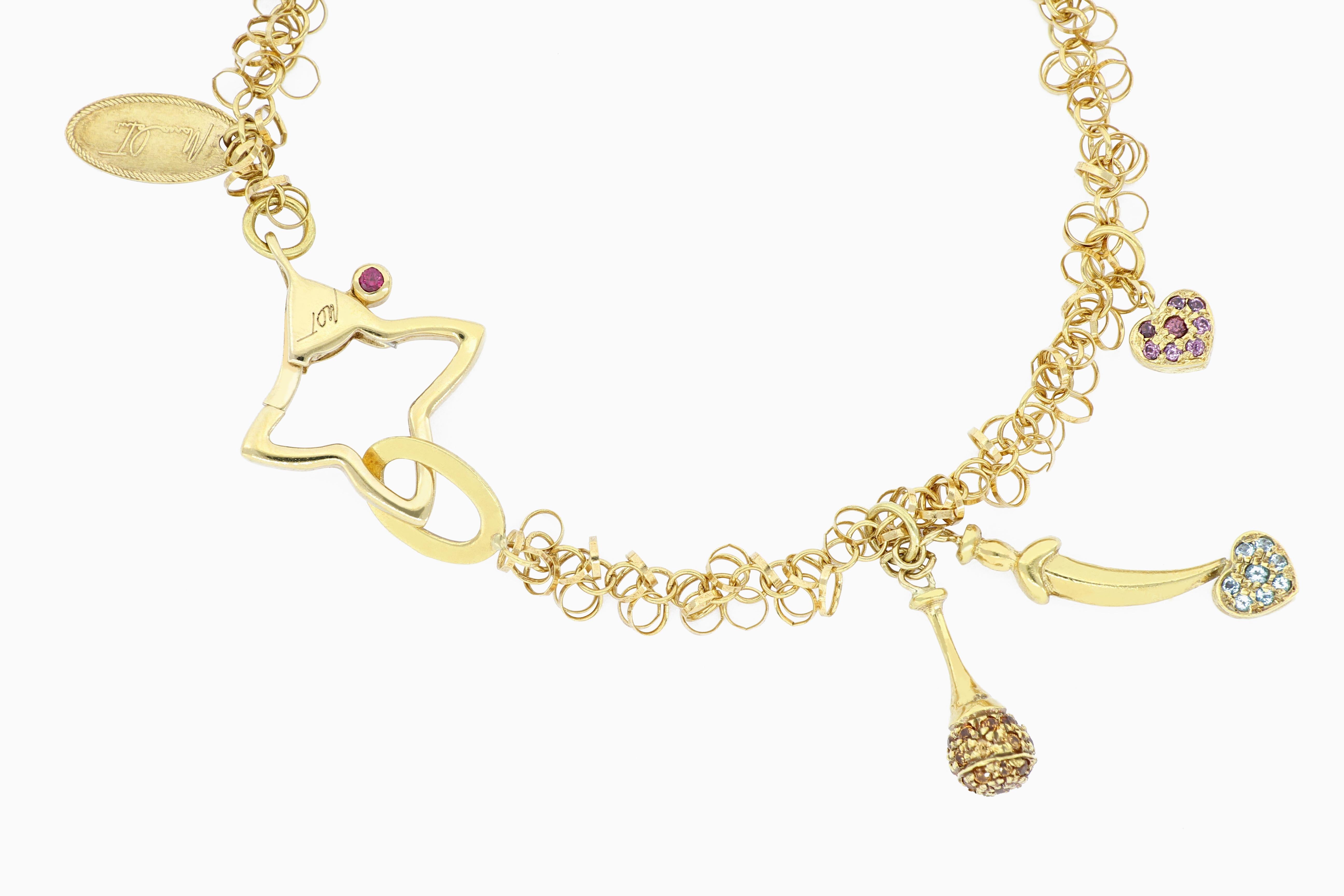 This very special piece of charm bracelet is designed and made in Italy, with exquisite workmanship, embellished with natural colour stones, mounted in 18 karat yellow gold. 
The company was founded one and a half centuries ago in Macau. The brand