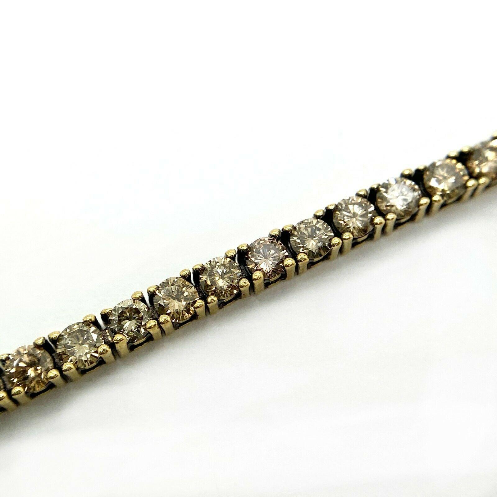 Elegant tennis bracelet decorated unique chocolate diamonds in 18K yellow  gold. Diamonds are SI1 clarity.
All carat weights and measurements are approximate and may vary slightly from the listed dimensions.
Specifications:
    main stone: ROUND