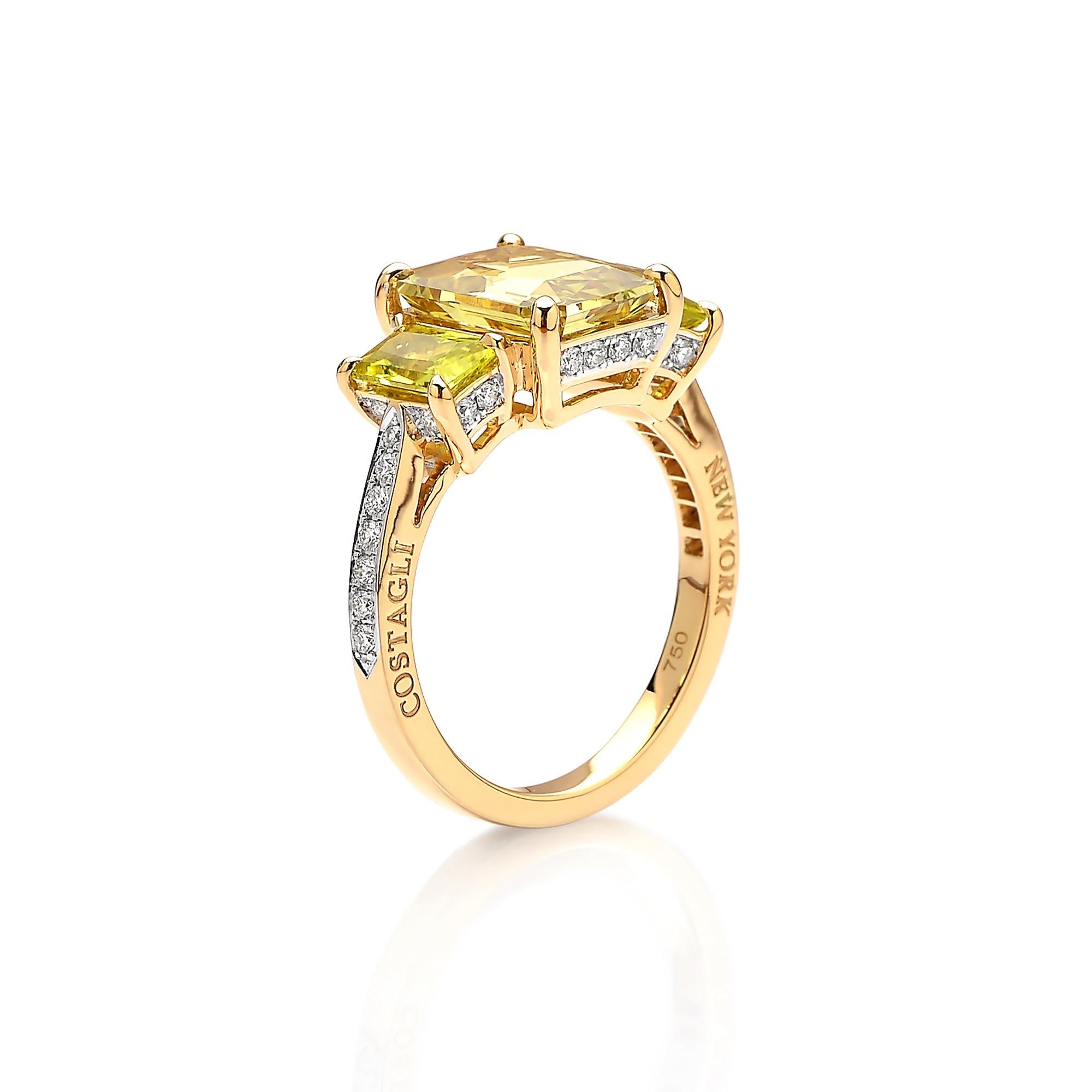 Emerald-cut Chrysoberyl ring flanked by yellow tourmaline side stones set in 18kt yellow gold with pave-set round, brilliant diamonds.

The clean lines of the cutting techniques and the exquisite pairing of the bright colored gemstones make this one