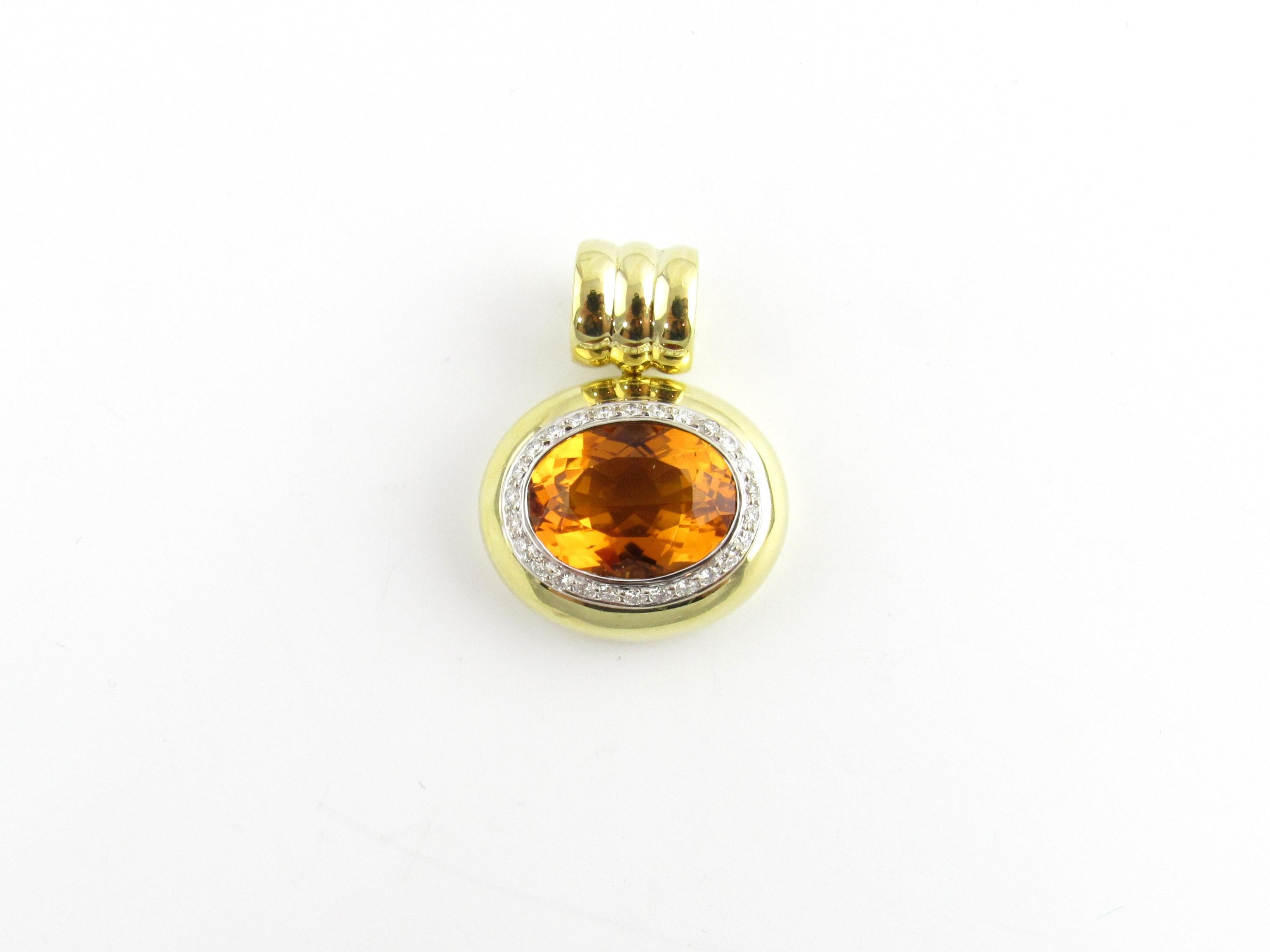 Vintage 18 Karat Yellow Gold Citrine and Diamond Pendant-

This lovely pendant features one 10.54cts oval citrine (17.16mm x 12.82mm x 8.58mm) surrounded by 27 round brilliant cut diamonds and set in beautifully detailed 18K yellow gold.

Citrine is