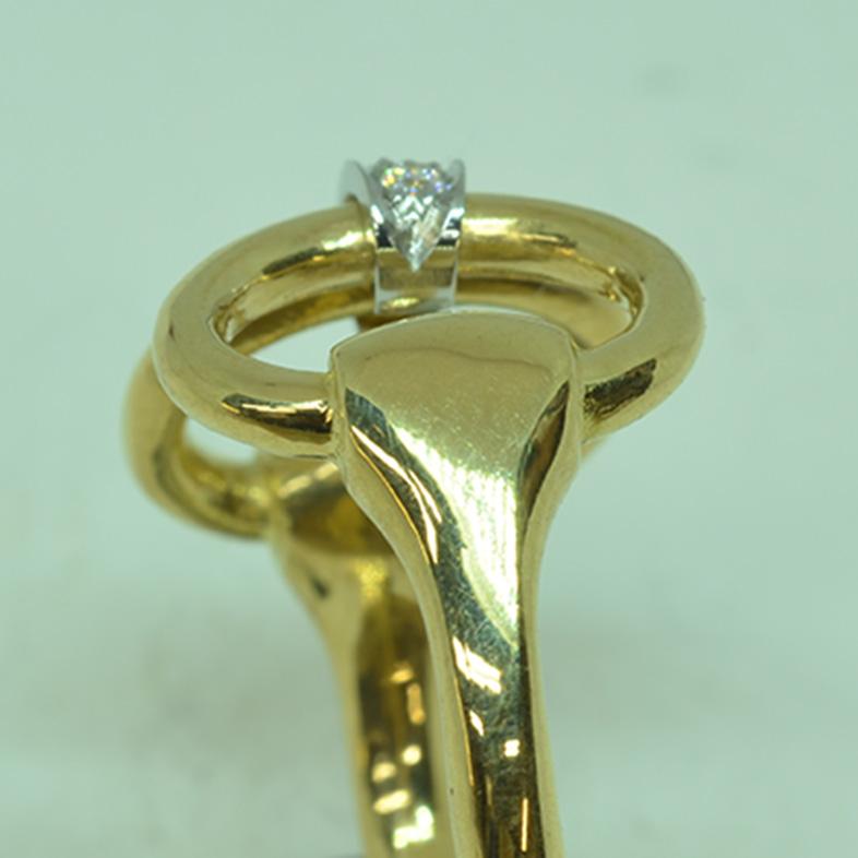 18 Karat Yellow Gold Classic Equestrian Platinum Diamond Linked Horsebit Ring. A favorite among the the horse set for decades, this classic design has never lost it’s appeal, crafted in heavy 18 Karat gold with a platinum link set with three round