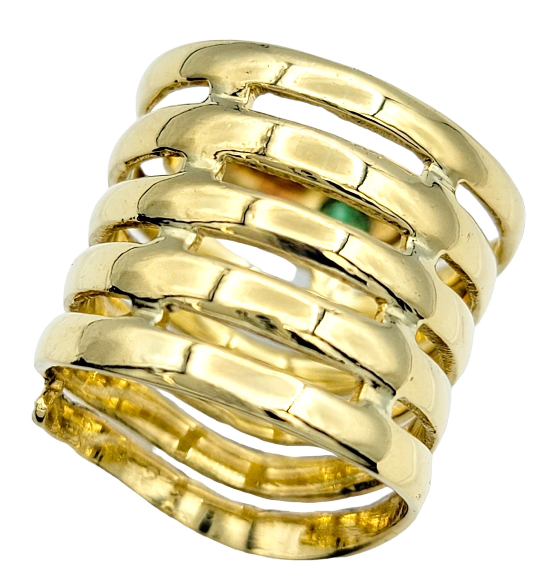 Contemporary 18 Karat Yellow Gold Coiled Snake Bypass Cocktail Ring with Emerald and Rubies For Sale