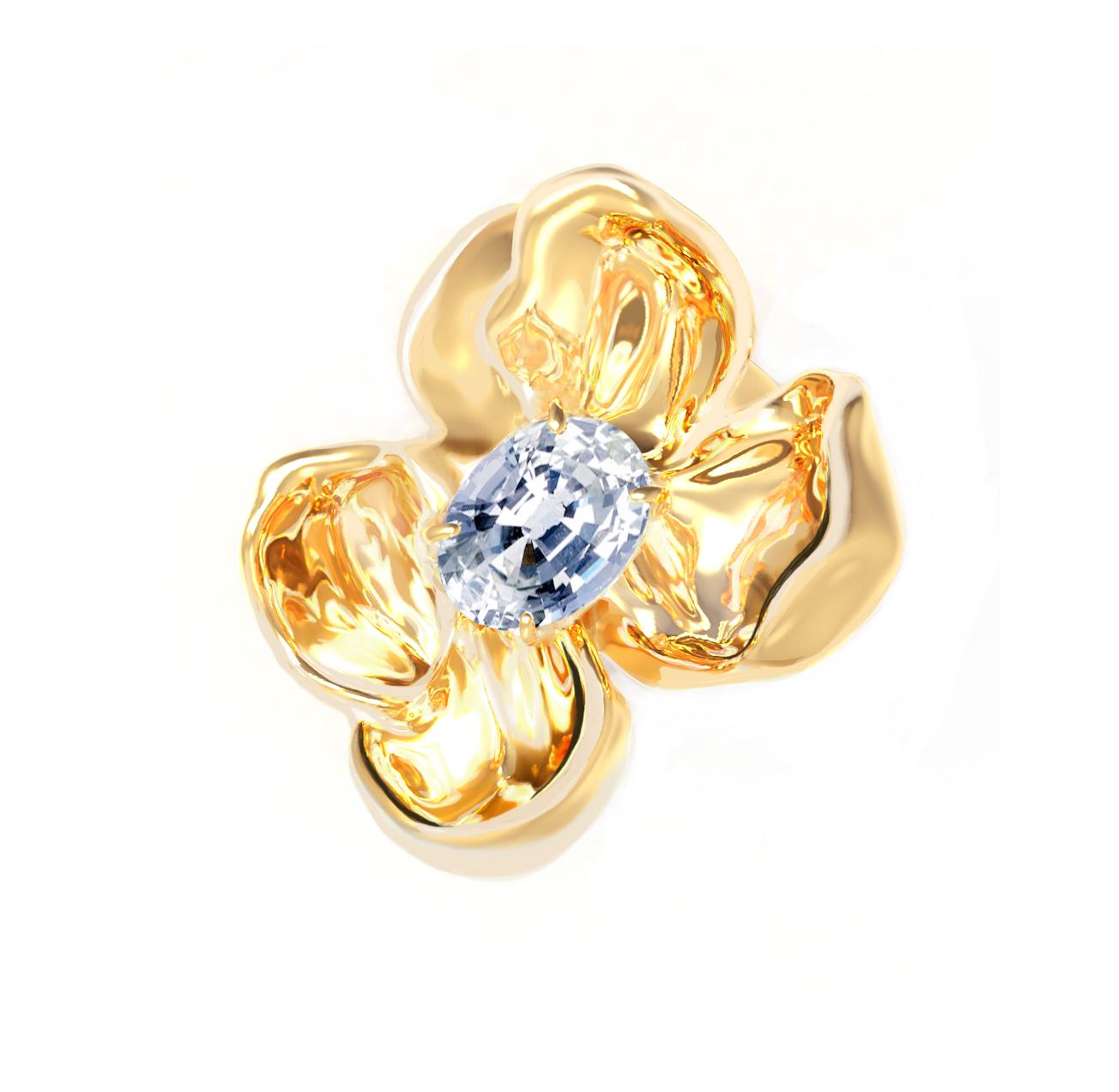 This Magnolia Flower contemporary brooch is in 18 karat yellow gold with clear and shiny light blue sapphire, 0.65 Carats. The water-surface of the gem multiplies the light, mirroring on the golden petals. The weight is 8.5 gr. The ring from this