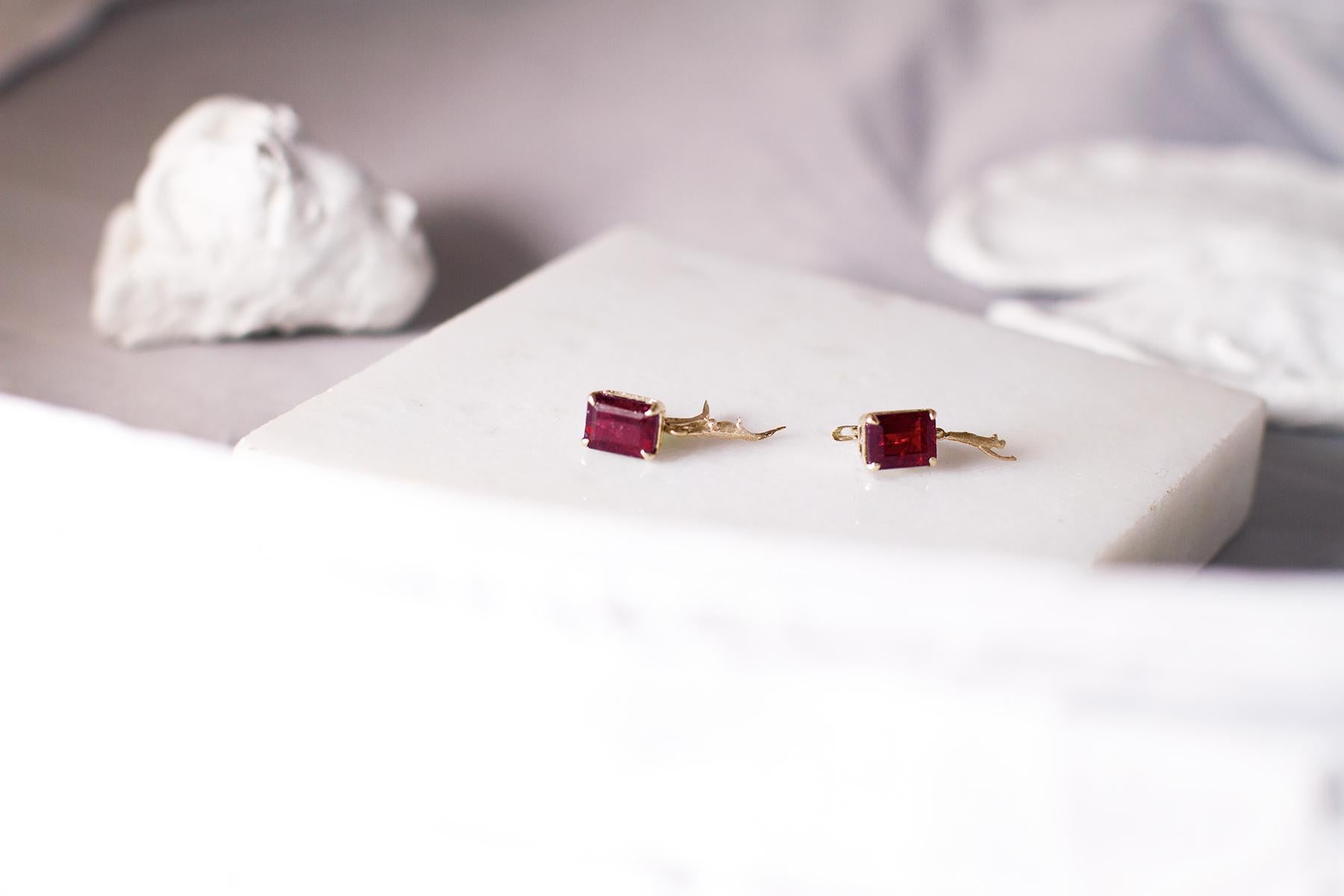 These contemporary clip-on earrings with rubies (11x9 mm each, rectangular cut) belong to Tea collection, which was featured in Vogue UA published issue. These earrings are made of 18 Karat yellow gold and designed by the oil painter from Berlin,