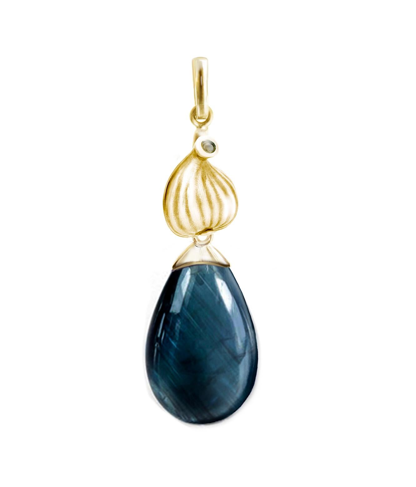 These contemporary drop earrings feature 18 karat yellow gold with natural vivid Indicolite tourmalines (17.5x10.5x6 mm each, 18.7 carats in total) and round diamonds. The Fig collection was showcased in a Vogue UA review and was designed by an