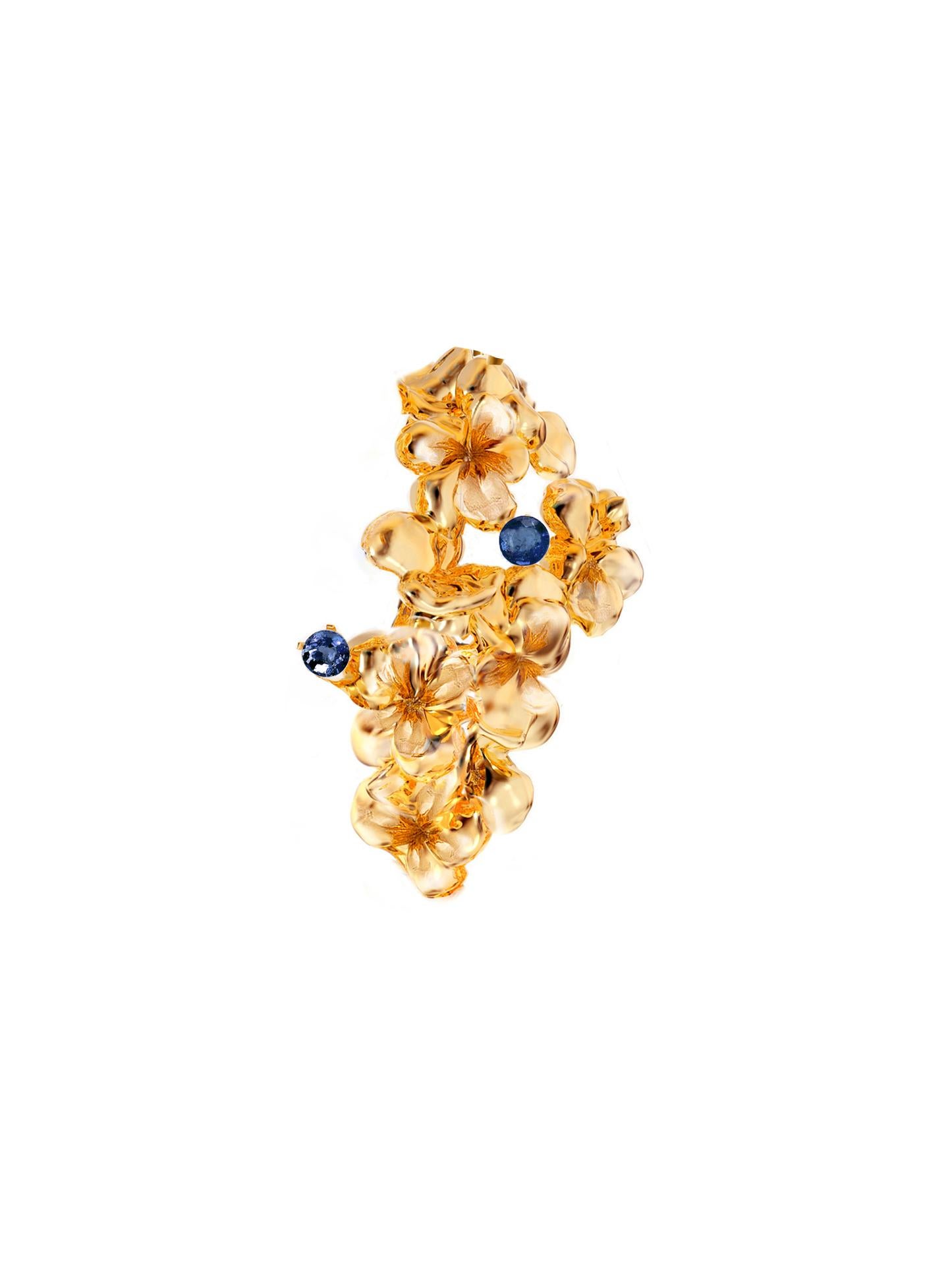 This contemporary Hortensia clip-on Sculptural earrings are in 18 karat yellow gold with round natural sapphires. The abstract sculptural design adds the extra highlights to the surface of the gold. The gems add the delicate blinks of colour. This