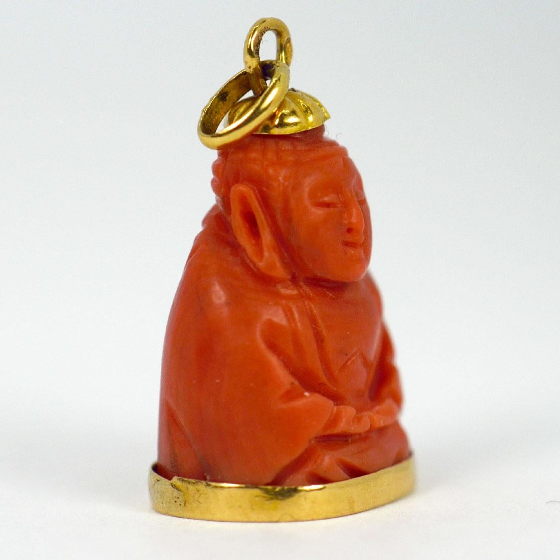 An 18 karat (18K) yellow gold charm pendant designed as a carved coral Buddha. Stamped with a provincial mark for French manufacture  and 18 karat gold with an unknown makers mark.

Dimensions: 2.5 x 1.5 x 1.05 cm (not including jump ring)
Weight: