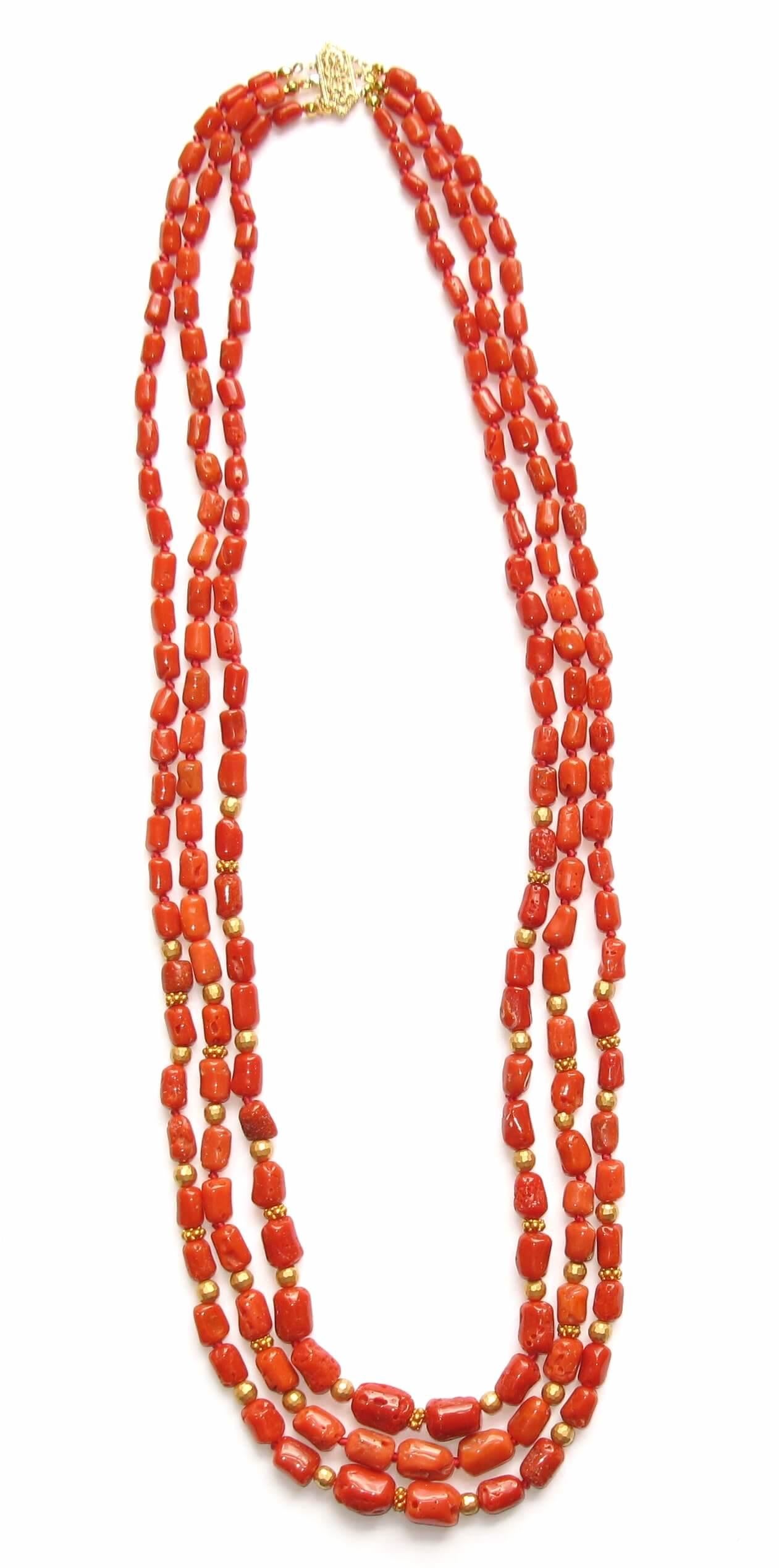 18 Karat Yellow Gold Coral Red Beaded 3 Strand Rope Necklace

A gorgeous red coral beaded necklace will rarely go overlooked. This versatile necklace looks incredible when worn alone, but you can elevate your look by pairing it with earrings. This
