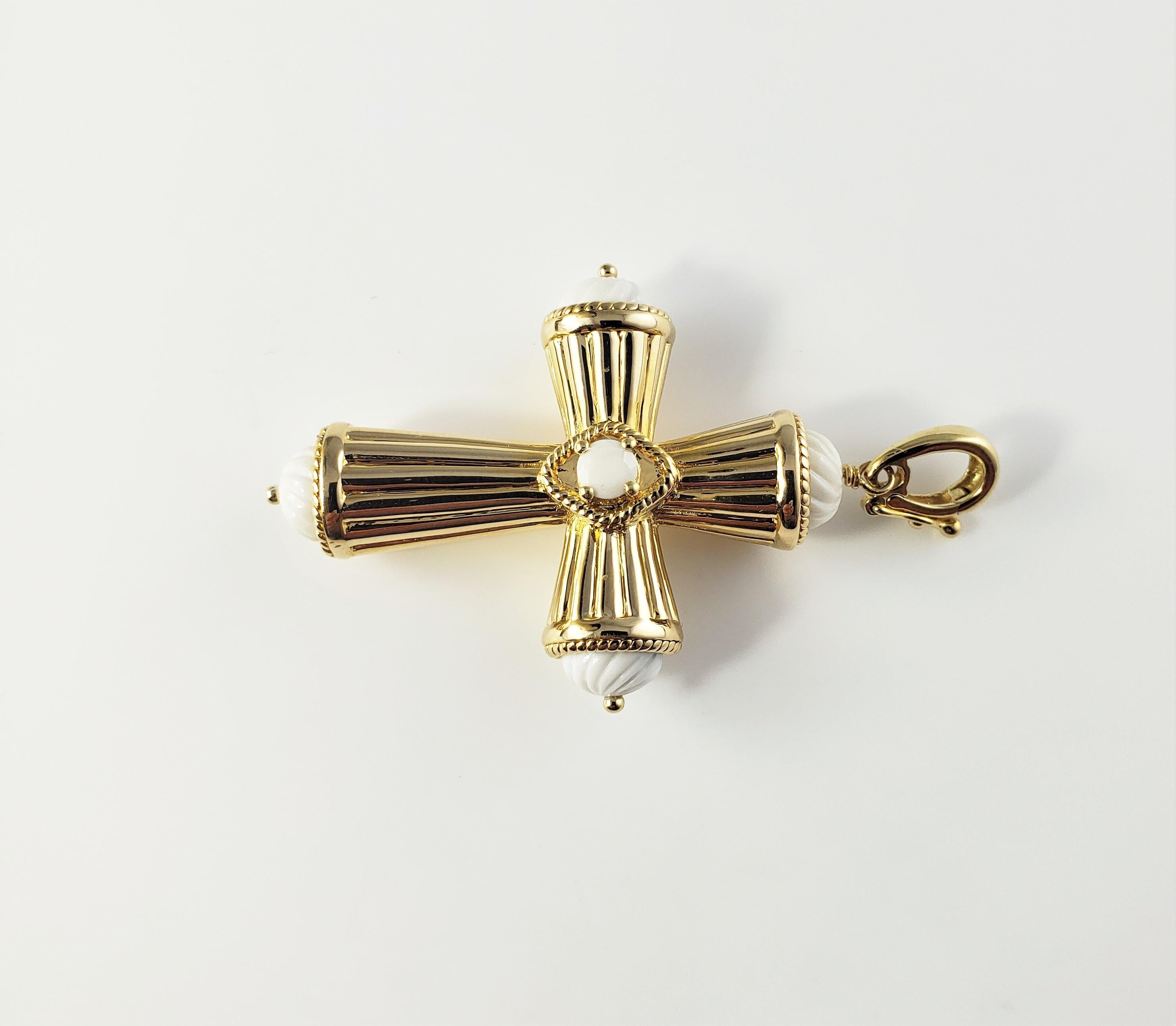 Vintage 18 Karat Yellow Gold Cross Pendant-

This stunning pendant cross pendant is crafted in beautifully detailed 18K yellow gold accented with white carved stones.

Size:  45 mm x  33 mm 

Weight:  5.5 dwt. /  8.7 gr. 

Stamped:  18K

Very good