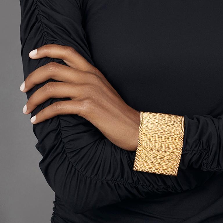Cuff bracelet made of ethereal and moving gold bars, part of the Makeda Collection.

Regal and empowering for the modern women. 
Makeda collection, Limited Edition made of ethereal gold bars tumbled in diamonds for an impressive never before