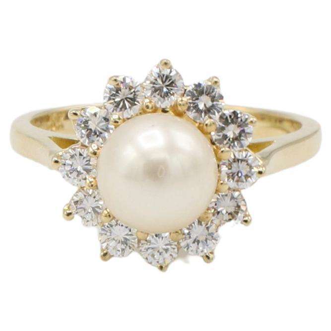 18 Karat Yellow Gold Cultured Pearl & Natural Diamond Halo Cocktail Ring 
Metal: 18k yellow gold
Weight: 4.80 grams
Diamonds: Approx. 0.75 CTW round natural diamonds F-G VS
Pearl: 7mm cultured pearl 
Size: 6.5 (US)
Height: 11mm
