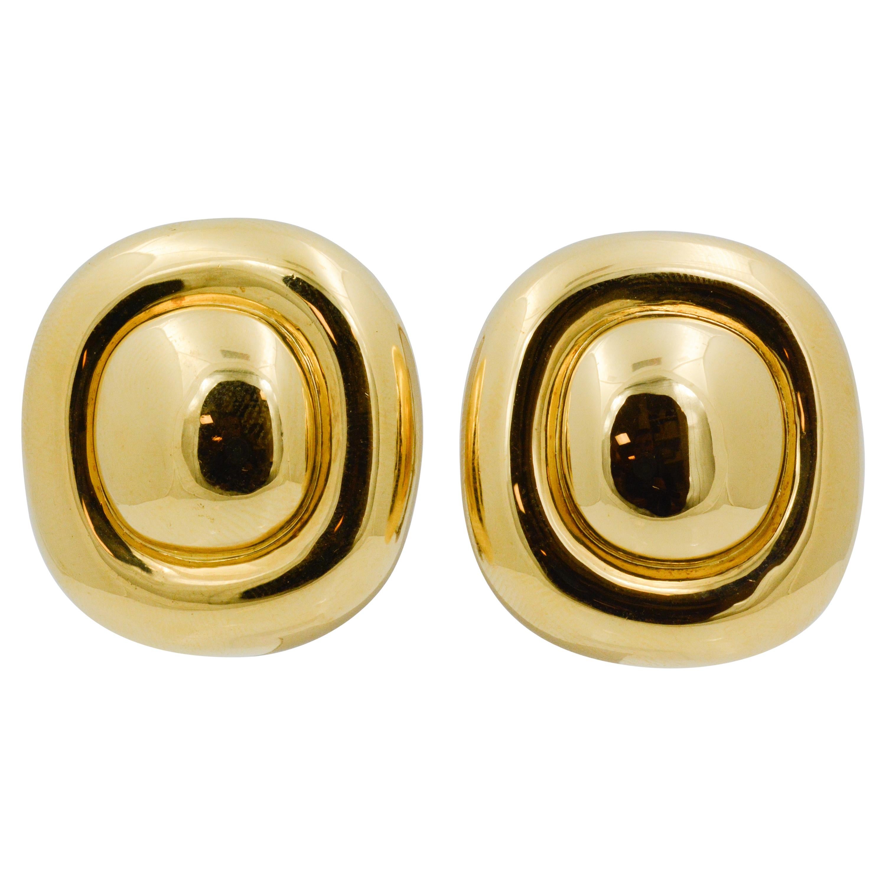 Here's a dazzling pair of 18 karat yellow gold cushion shape earrings from the late 20th century. When it's time to get dressed up for the office, why not slip on these classy earrings with 18 Karat white gold posts and Omega clip backs. Earrings