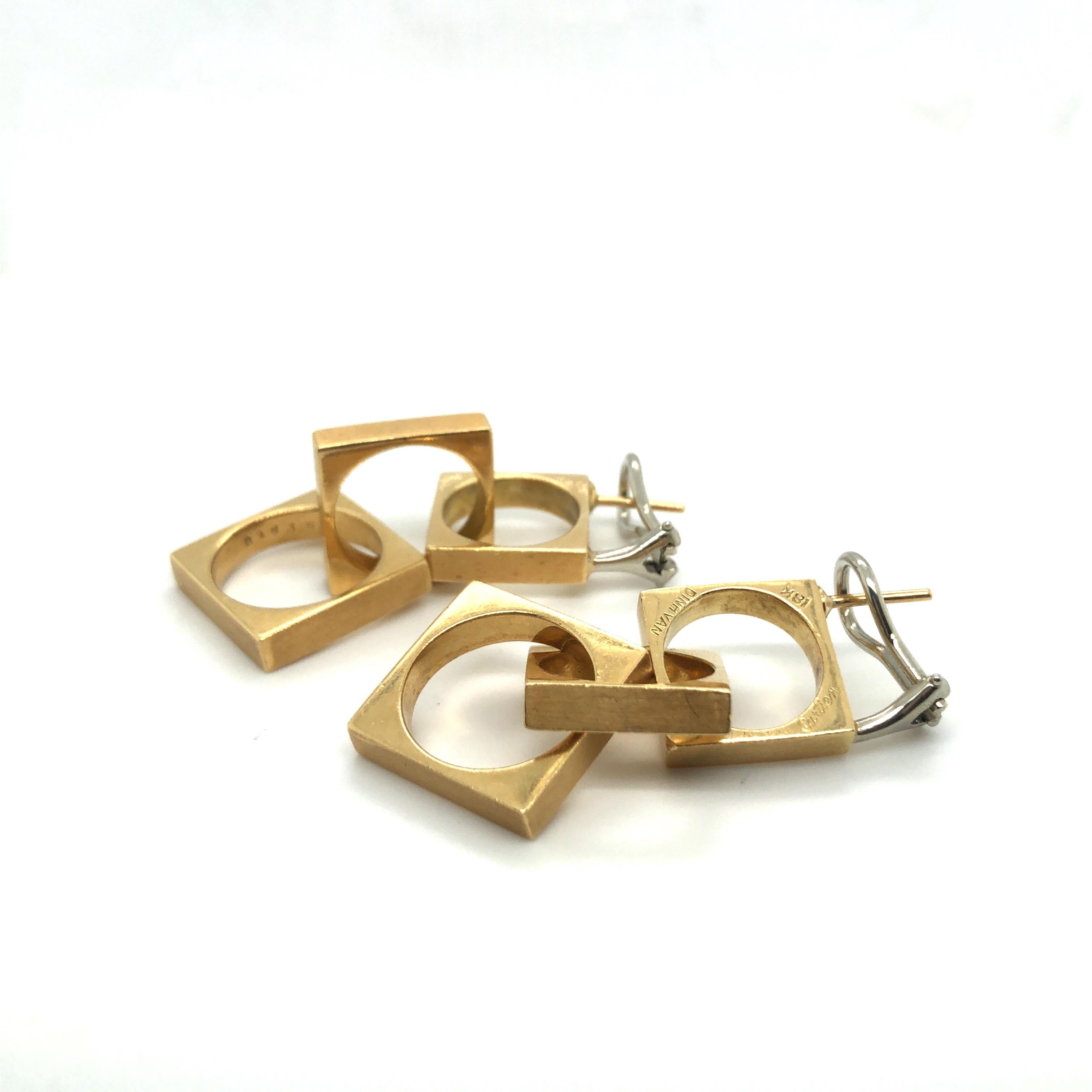 Stylish geometric 18 karat yellow gold dangle ear pendants by Dinh Van for Cartier.
Masterfully handcrafted in 18 karat yellow gold, each earring consists of 3 interlocking square links with an open circular center and is completed by an hinged