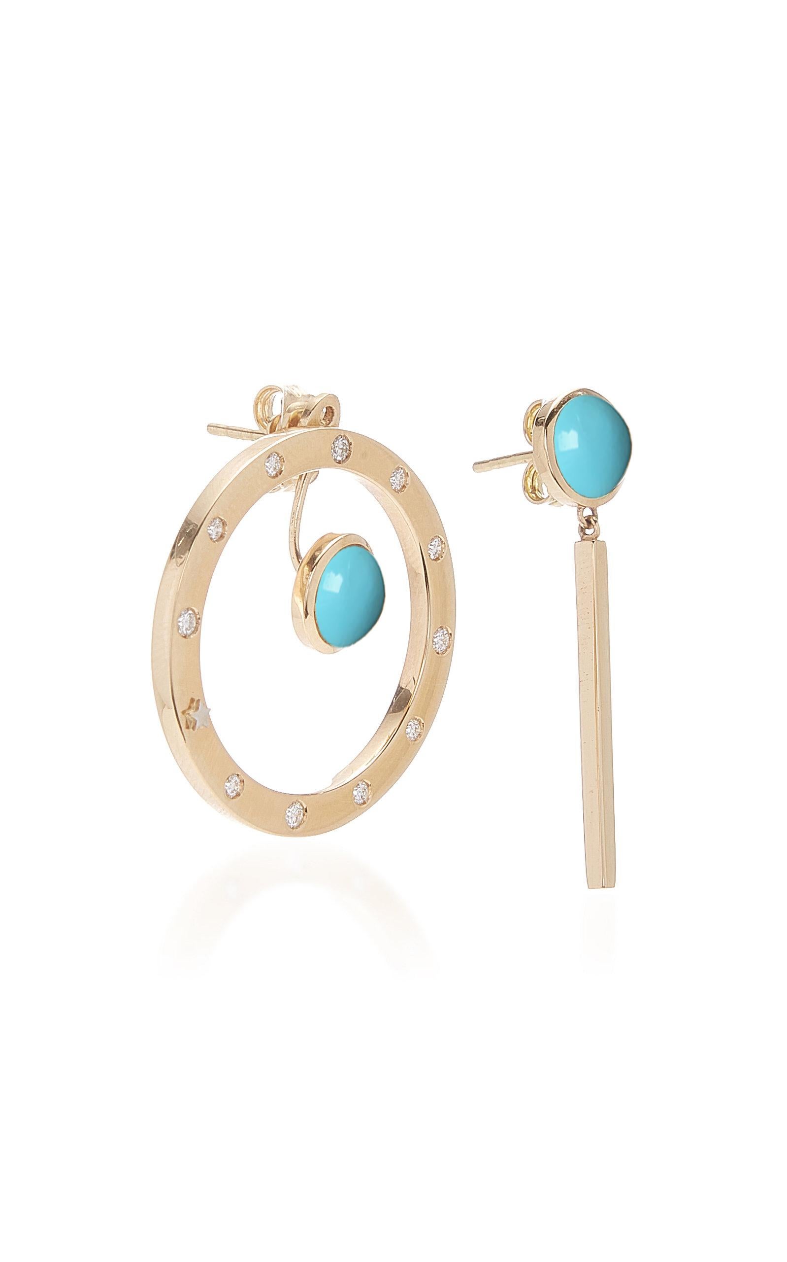 ORA Collection.
Inspired by the concept of time, Anna Maccieri Rossi's 'ORA Earrings' feature a mismatched pair with circular hoop and linear drop, both with natural turquoise cabochons. The 11 white diamonds and a gold star at 8 o'clock around the