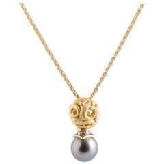 18 Karat Yellow Gold Diamond and Black Pearl Dolphin Pendant Necklace