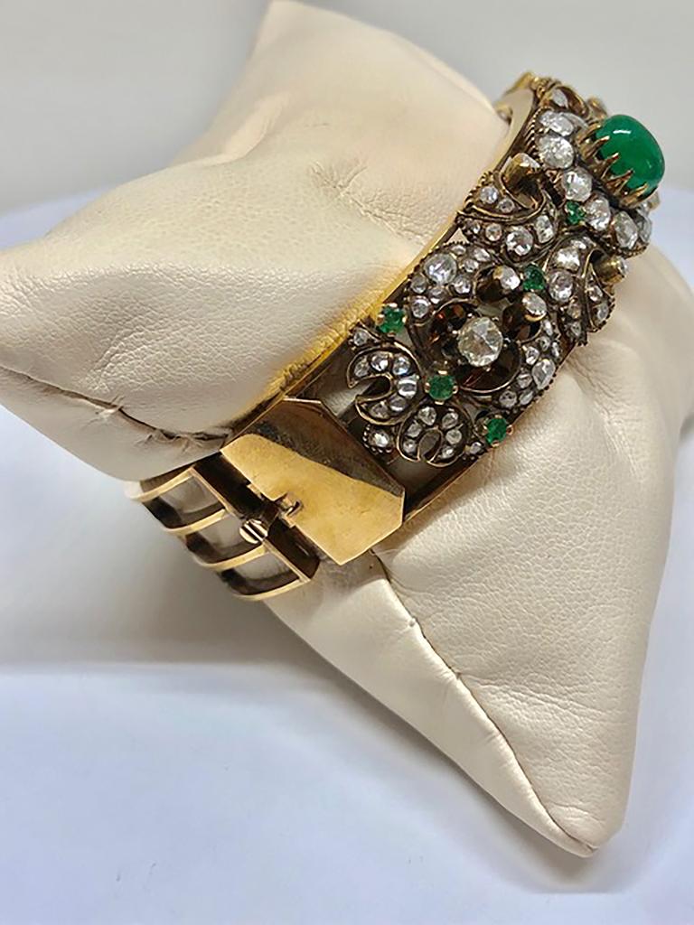 Victorian revival bracelet, circa 1930’s 18Kt yellow gold
Rose cut diamonds approx 3cts Cabochon emerald approx 2.5cts Millegrained edges