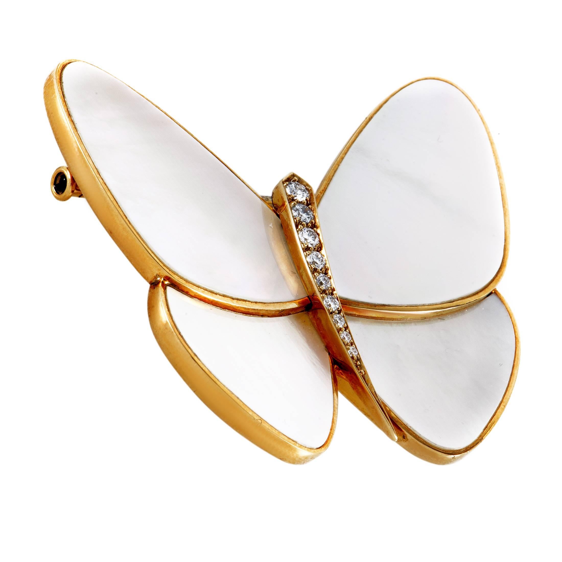 Designed in the brand's authentic style and crafted with exquisite expertise, this spellbinding brooch form Van Cleef & Arpels boasts the marvelous form of a butterfly presented in a tasteful blend of 18K yellow gold, glittering diamonds and subtle