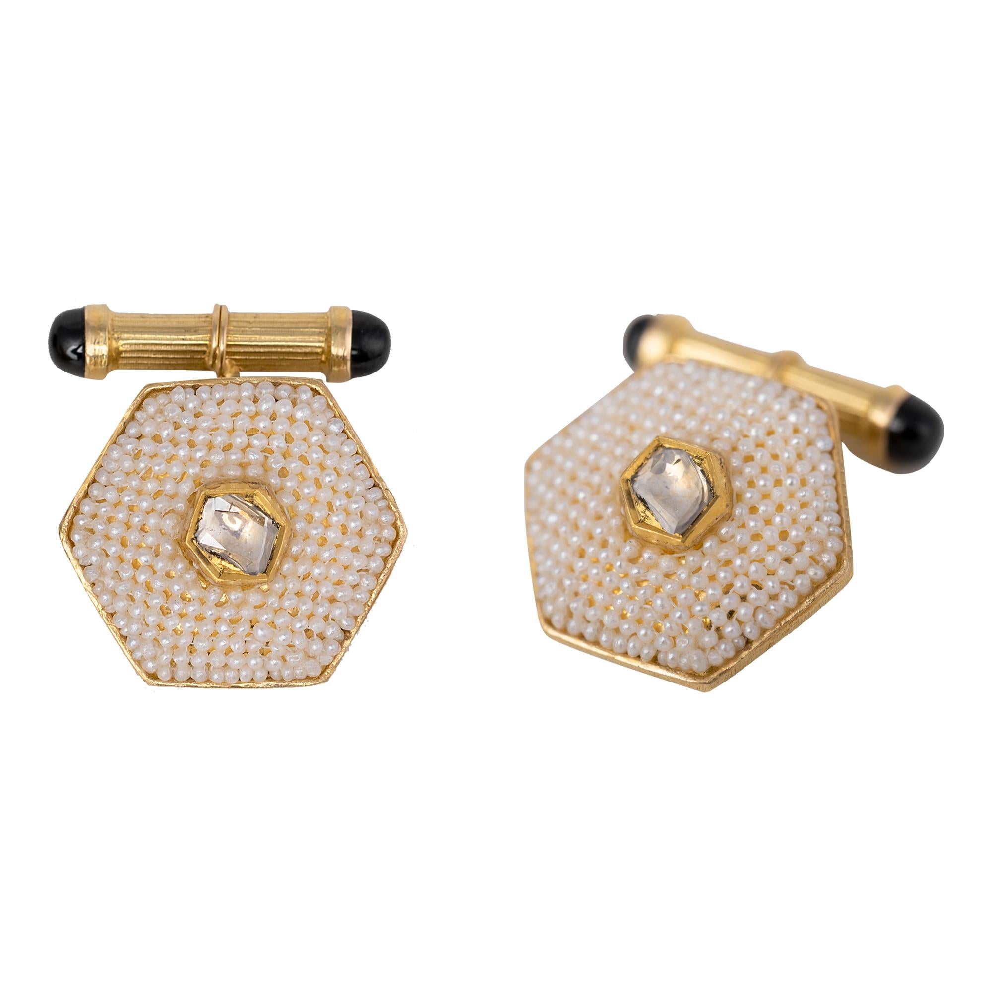 18 Karat Yellow Gold Diamond and Pearl Cufflinks
This sophisticated 19th-century-inspired off-white pearl and diamond polki cufflink is immaculate. The center is an unusual fancy cut polki diamond solitaire in an art-deco closed setting with