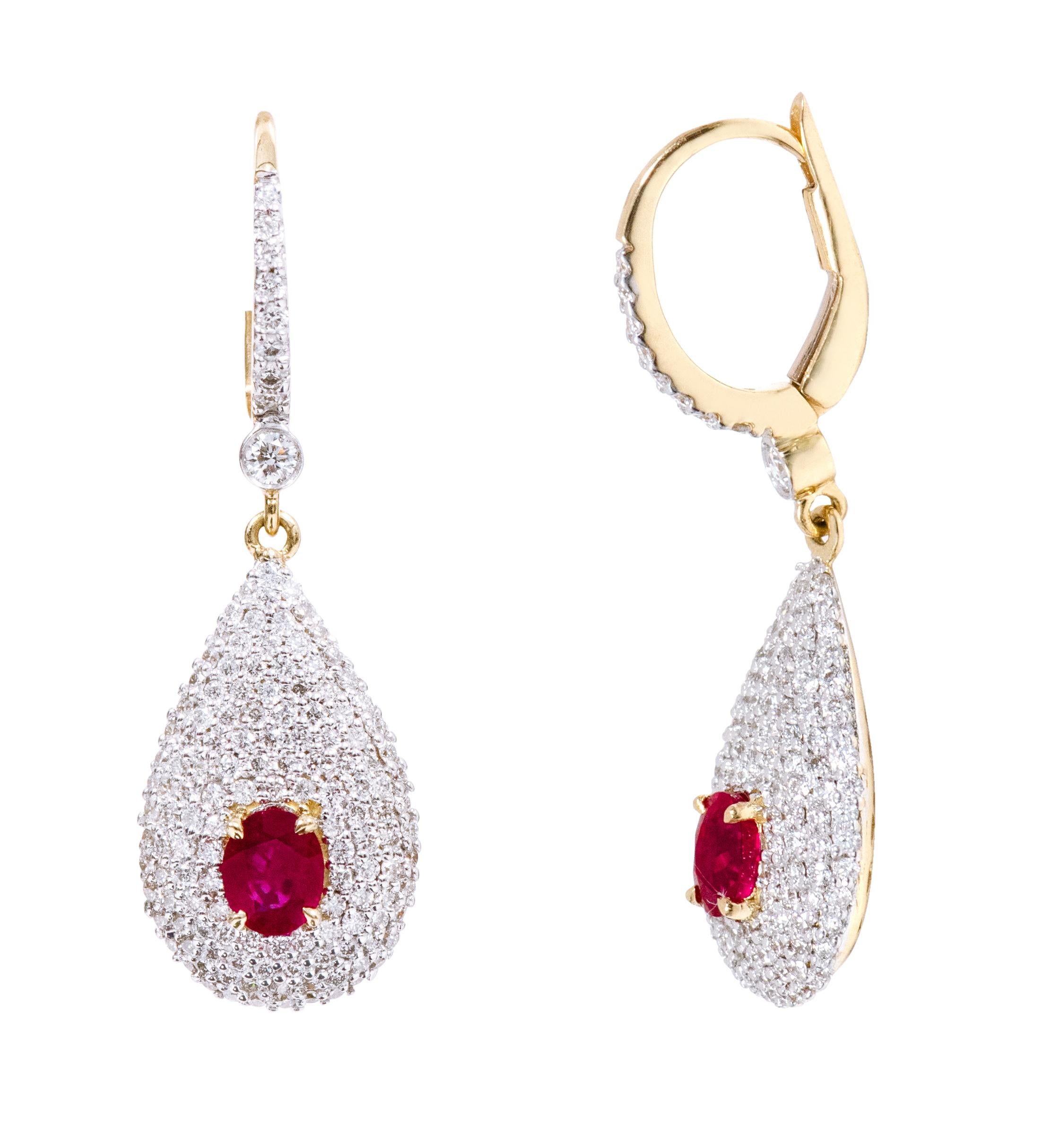 18 Karat Yellow Gold Diamond and Ruby Drop Earrings

This stunning wine ruby and diamond earring is a transcending stylish pair. The inspiration for the design comes from the open ripe Avocado with the 4 layers of micro pave set diamonds merging