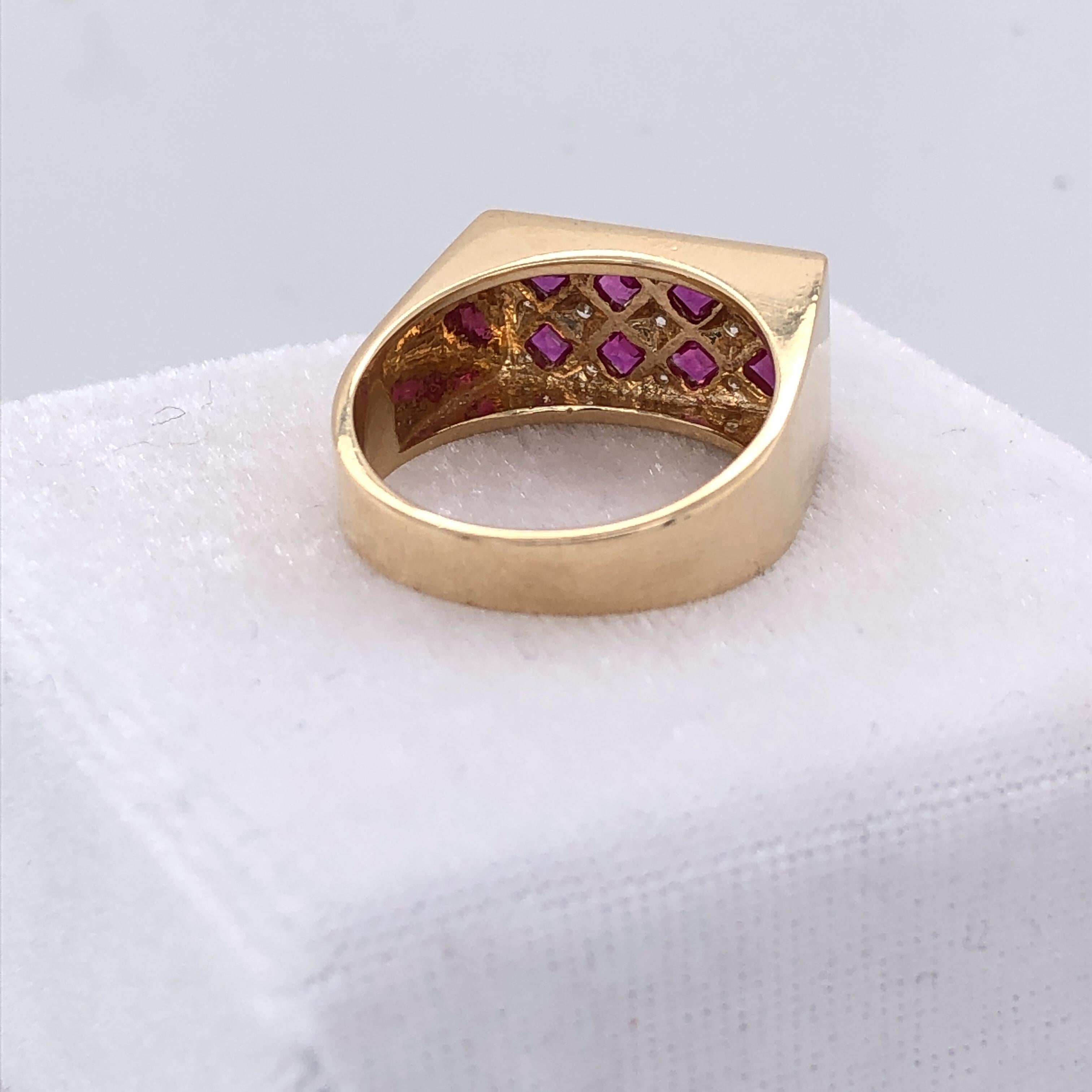 One 18 karat yellow gold ring set with eight 2.2mm square rubies, approximately 0.75 carat total weight and fifteen 1mm round brilliant diamonds approximately 0.20 carat total weight with K/L color and I1 clarity.  The top of the ring measures 16.5
