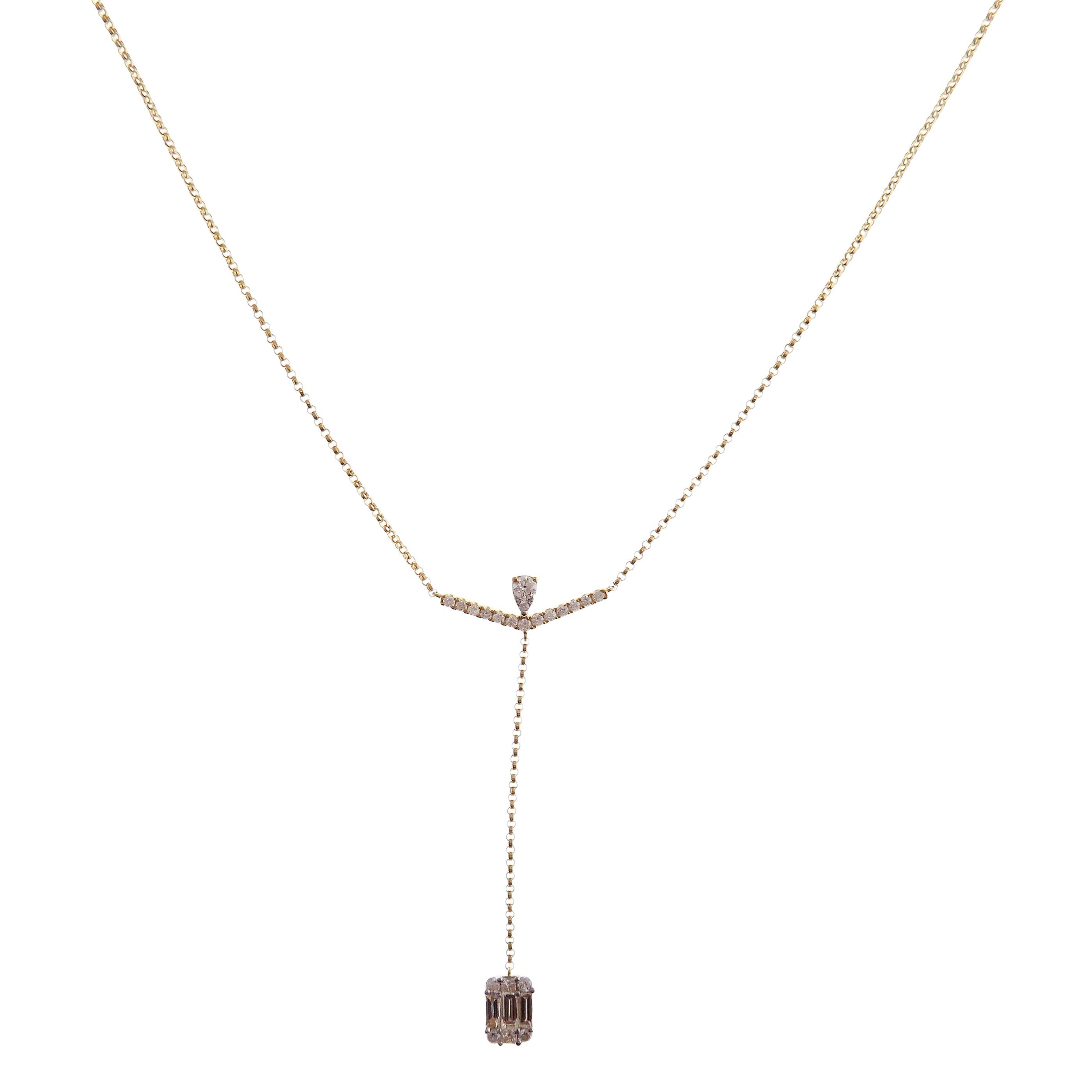 This baguette v-neck necklace is crafted in 18-karat yellow gold, weighing approximately 0.60 total carats of SI-H Quality white diamond. 

Necklace is 16