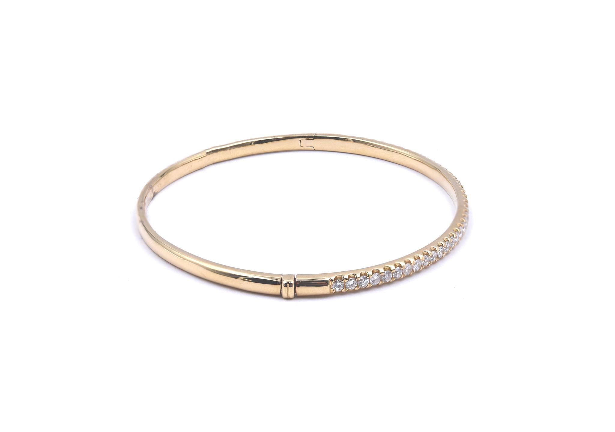 Designer: custom designed 
Material: 18K yellow gold
Diamonds: 39 round brilliant cut = 1.00cttw
Color: G
Clarity: VS2
Dimensions: bracelet will fit a 7-inch wrist 
Weight:  10.38 grams
