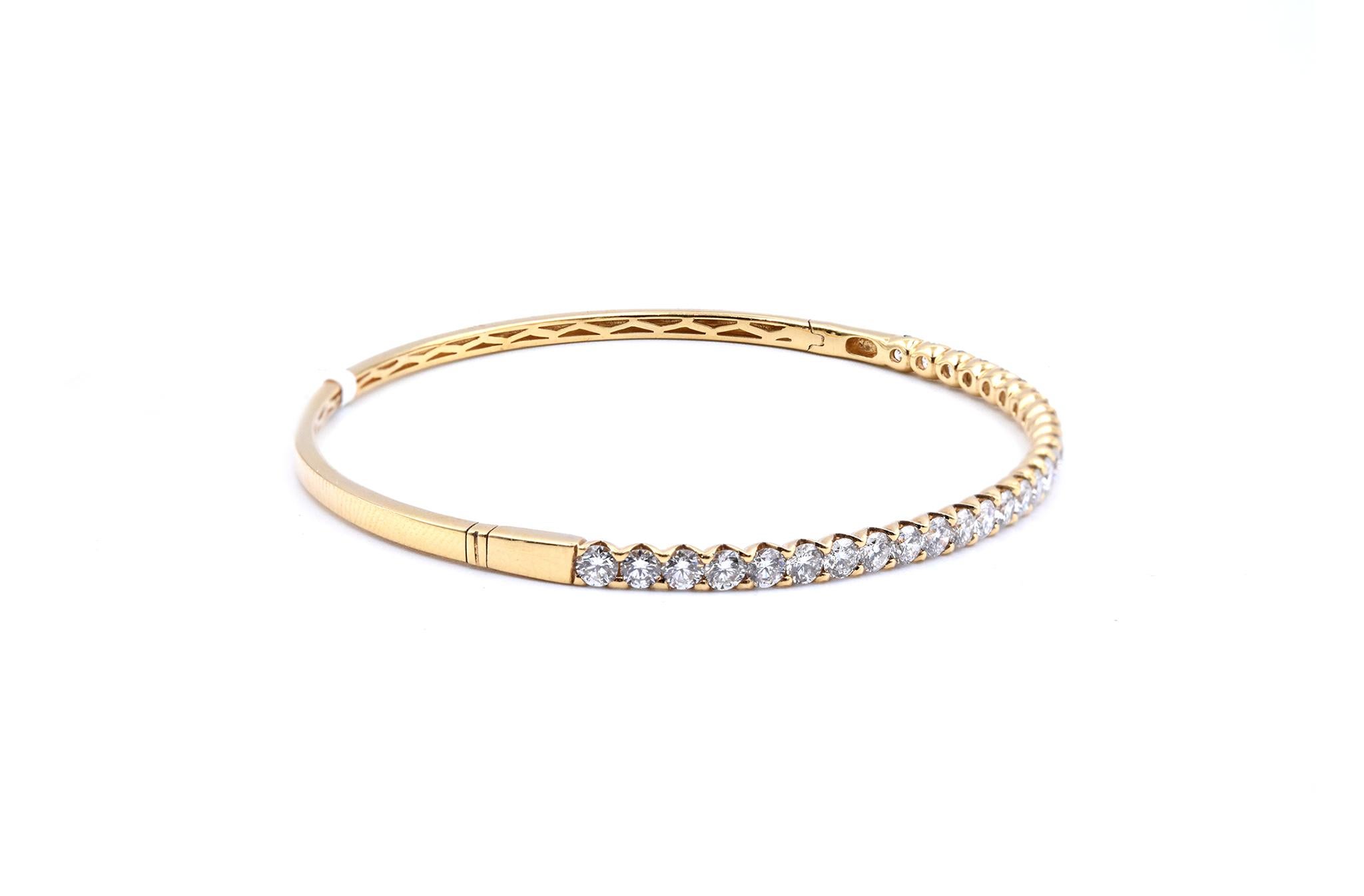 Material: 18K yellow gold
Diamonds:  28 round cut = 2.40cttw
Color: G
Clarity: VS
Dimensions: bracelet will fit up to a 6.5-inch wrist 
Weight: 9.25 grams
