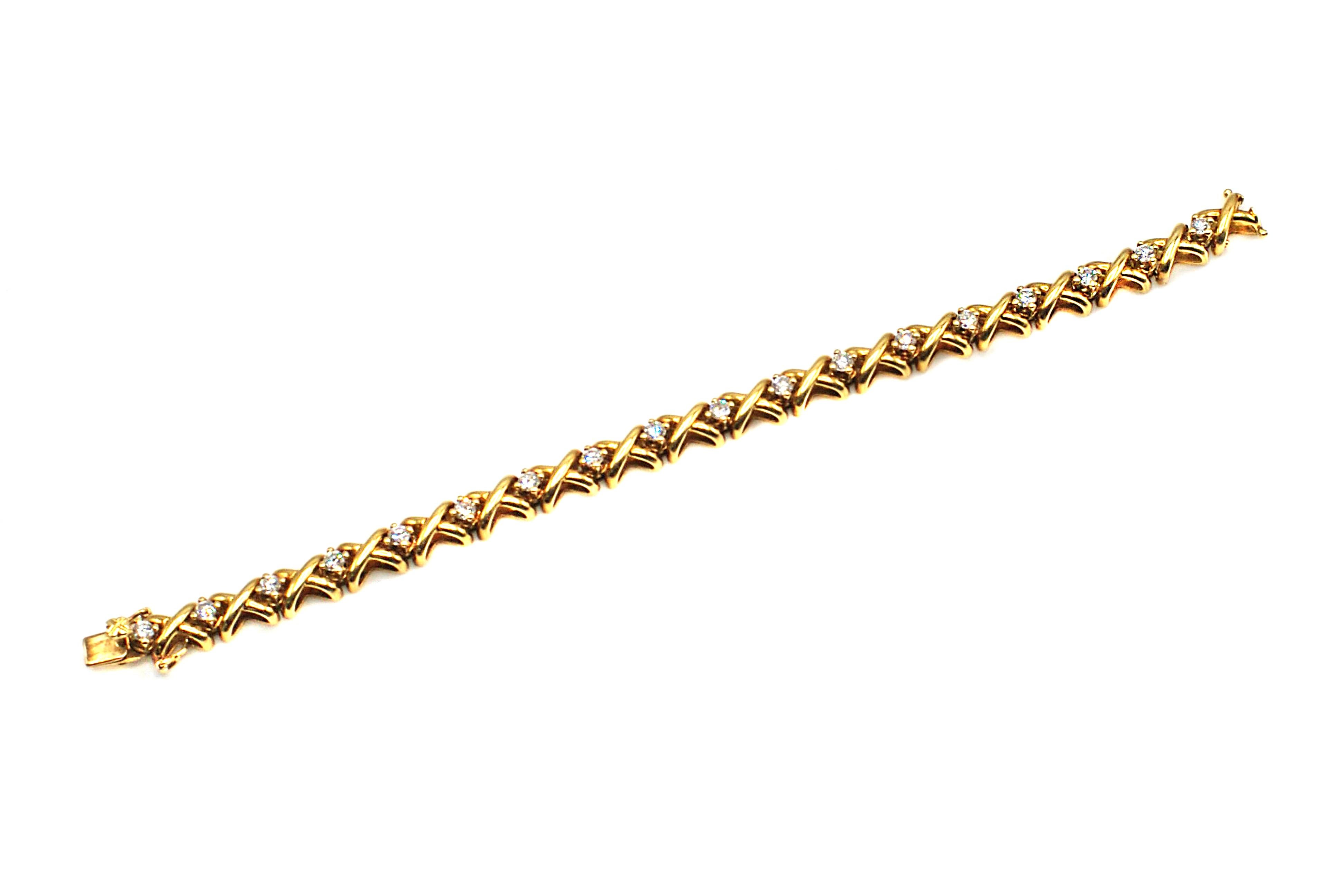 Chic 18 karat yellow gold diamond bracelet, finely crafted out of 18 golden x's and separated by bright white round brilliant cut diamonds. The smooth finish of this bracelet makes for a most comfortable wear and an elegant accessory for any